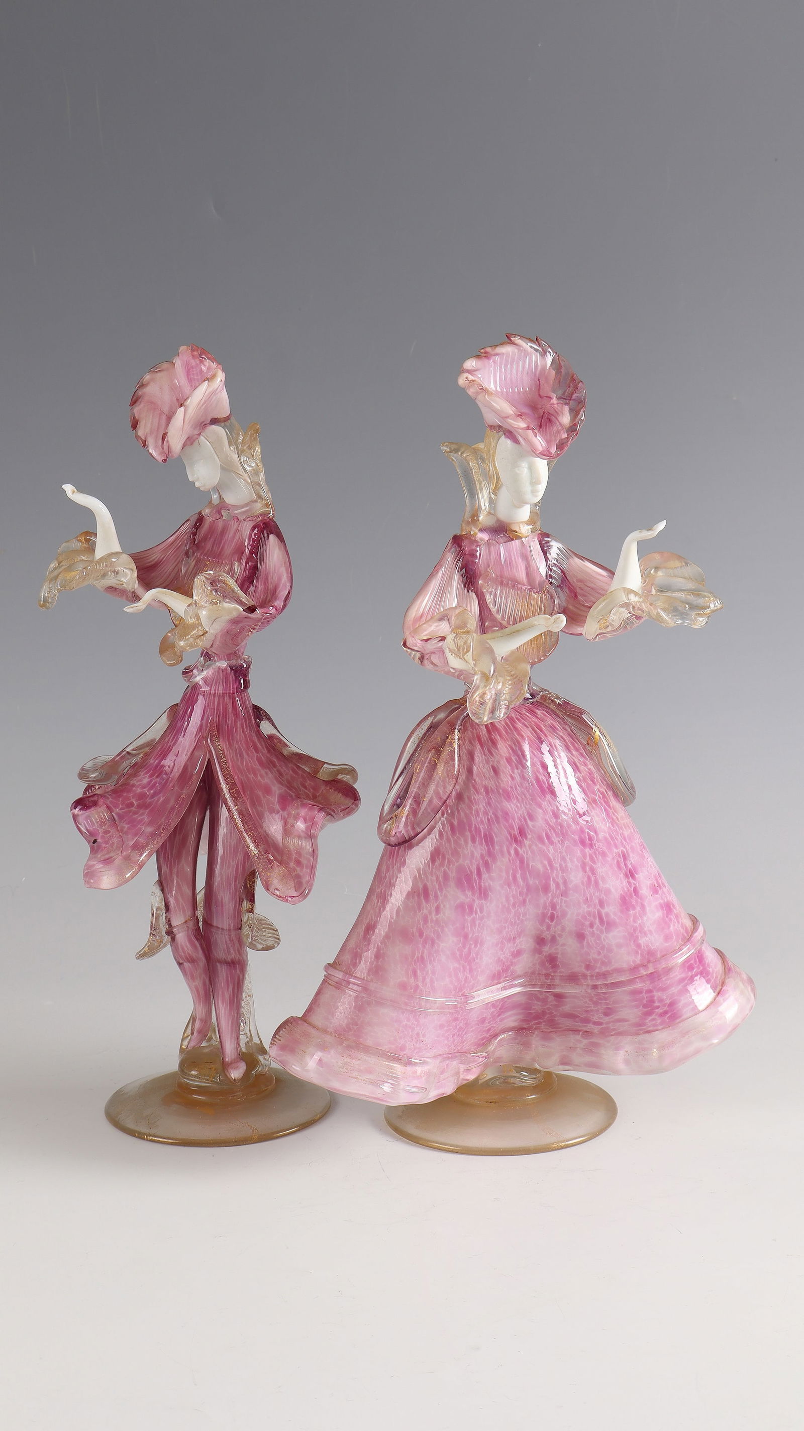 Venetian Rococo couple: Venetian Rococo pair Murano, 50s/60s clear and coloured glass with 'lattimo', partially with fused gold powder, freely formed and fused. H. 33 cm Lit.: G. Cappa, Le Genié Verrier de l'Europe, ed.: Ma