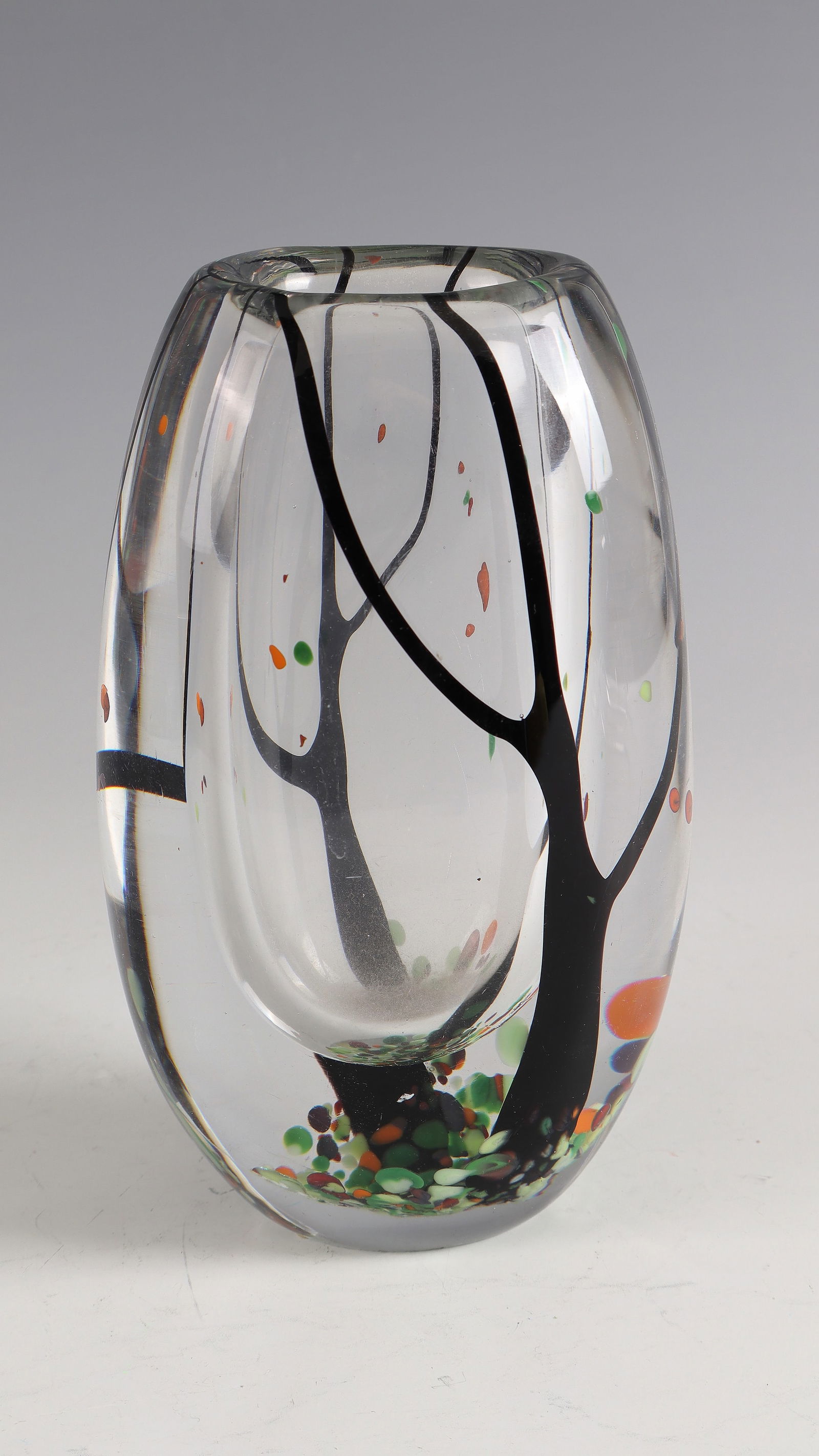 Vase ''Autumn'': Vase ''Autumn'' Vicke Lindstrand (design), Kosta (execution), 1954 Multi-coloured decoration enclosed in multi-pierced colourless glass. Underside signed: Kosta LU 2010 (in diamond crack). H. 17.3 cm