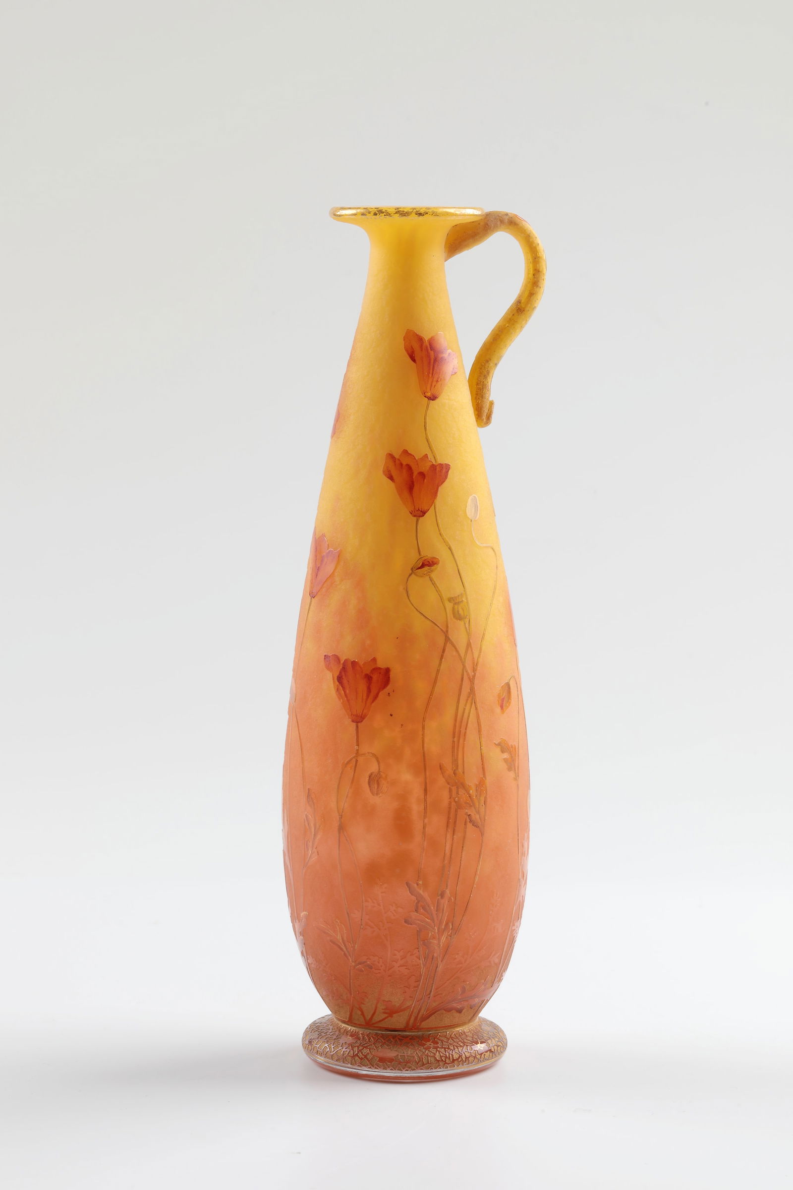 Vase with handle ''Coquelicot'': Vase with handle ''Coquelicot'' Daum Frères, Nancy, c. 1900 Colourless flashed glass with lemon-yellow and rust-brown powder inclusions, roughly etched, polychrome enamelled and gold-tempered. Decor: