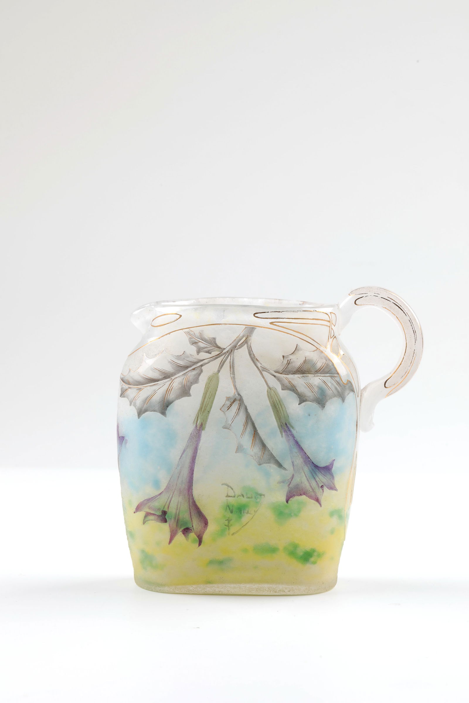 Small jug with angel's trumpet: Small jug with angel's trumpet Daum Frères, Nancy, c. 1910 Colourless, oval glass with white, green, yellow and light blue powder inclusions, colourless overlay, etched decoration: angel's trumpets w