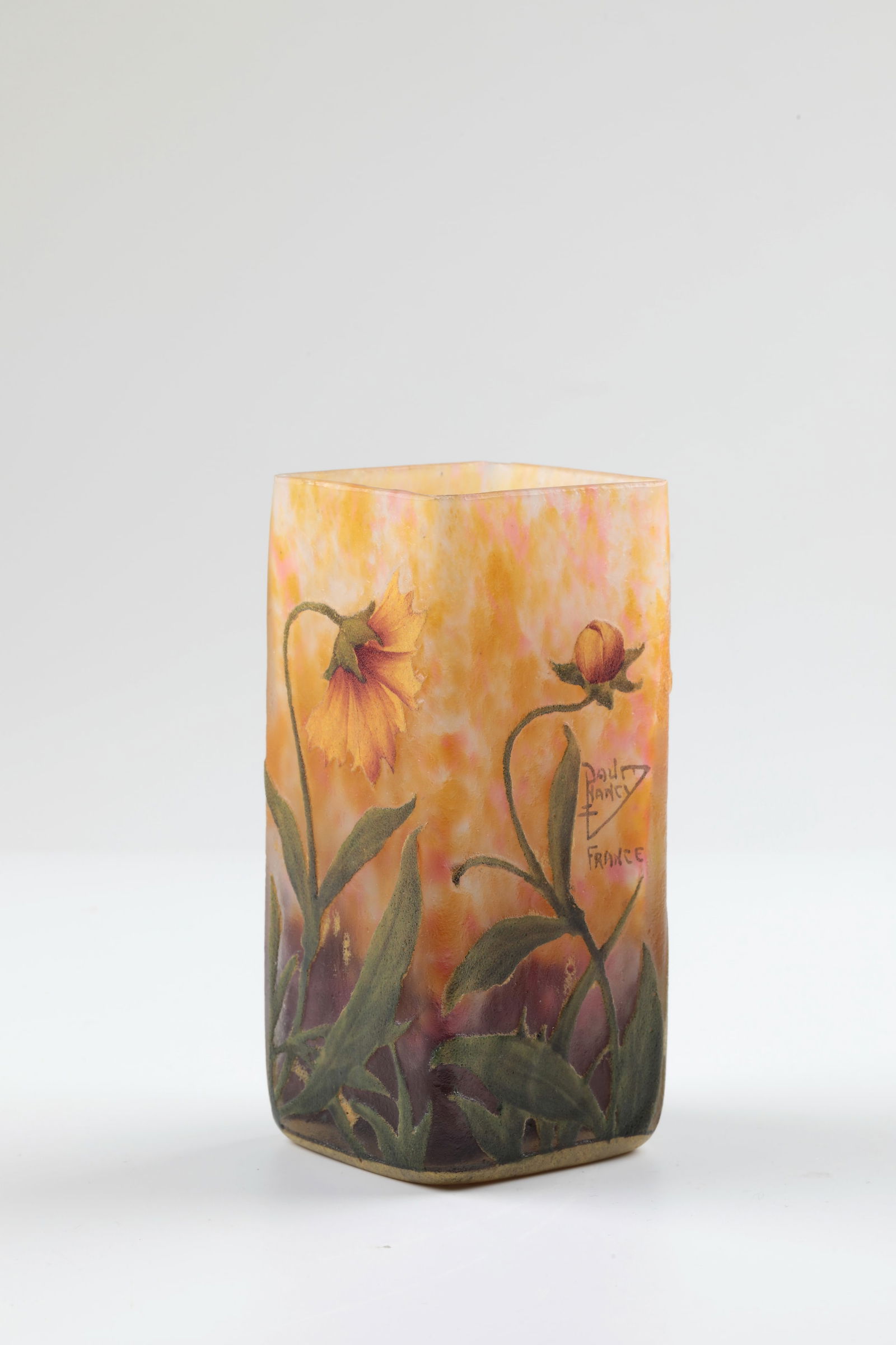 Square vase ''Arnica'': Square vase ''Arnica'' Daum Frères, Nancy, c. 1905-1910 Rectangular body on a square stand. Colourless glass with pink, yellowish and dark purple powder inclusions and yellowish enamel melting. Etche