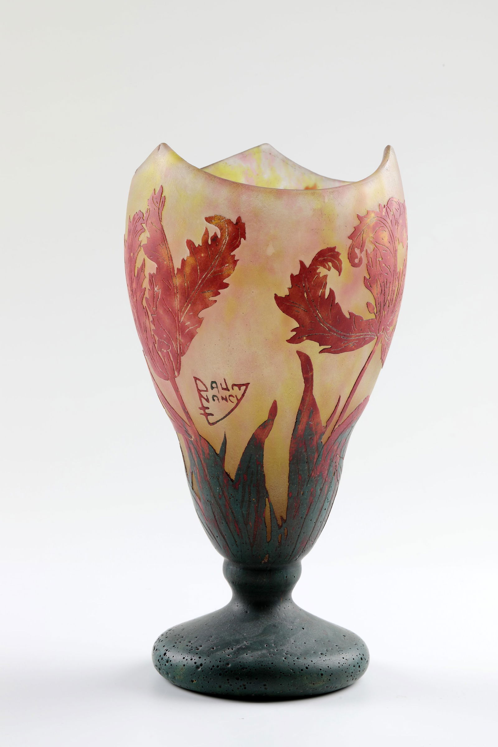 Foot vase ''Tulipes perroquet'': Foot vase ''Tulipes perroquet'' Daum Frères, Nancy, c. 1919-22 Stylized flower shape. On an ascending disc foot, curly cuppa with triple raised lip edge. Colourless flashed glass with yellow and