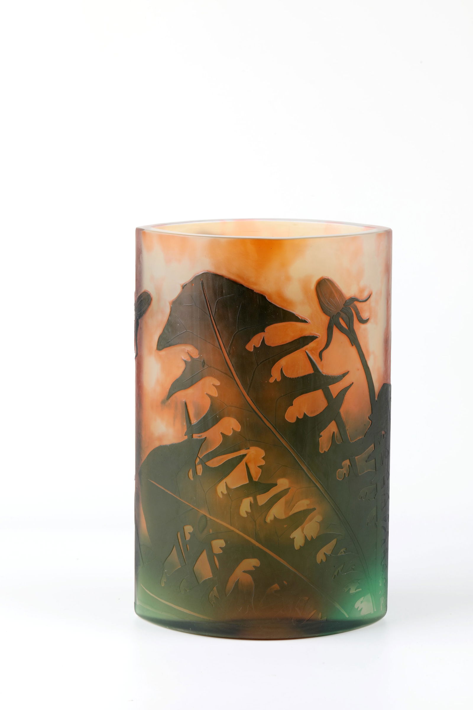Vase ''Pissenlits dent-de-lion'': Vase ''Pissenlits dent-de-lion'' Daum Frères, Nancy, circa 1905 Colourless flashed glass in orange and green with large dandelion leaves and buds. In the polished outline inscribed: Daum Nancy with