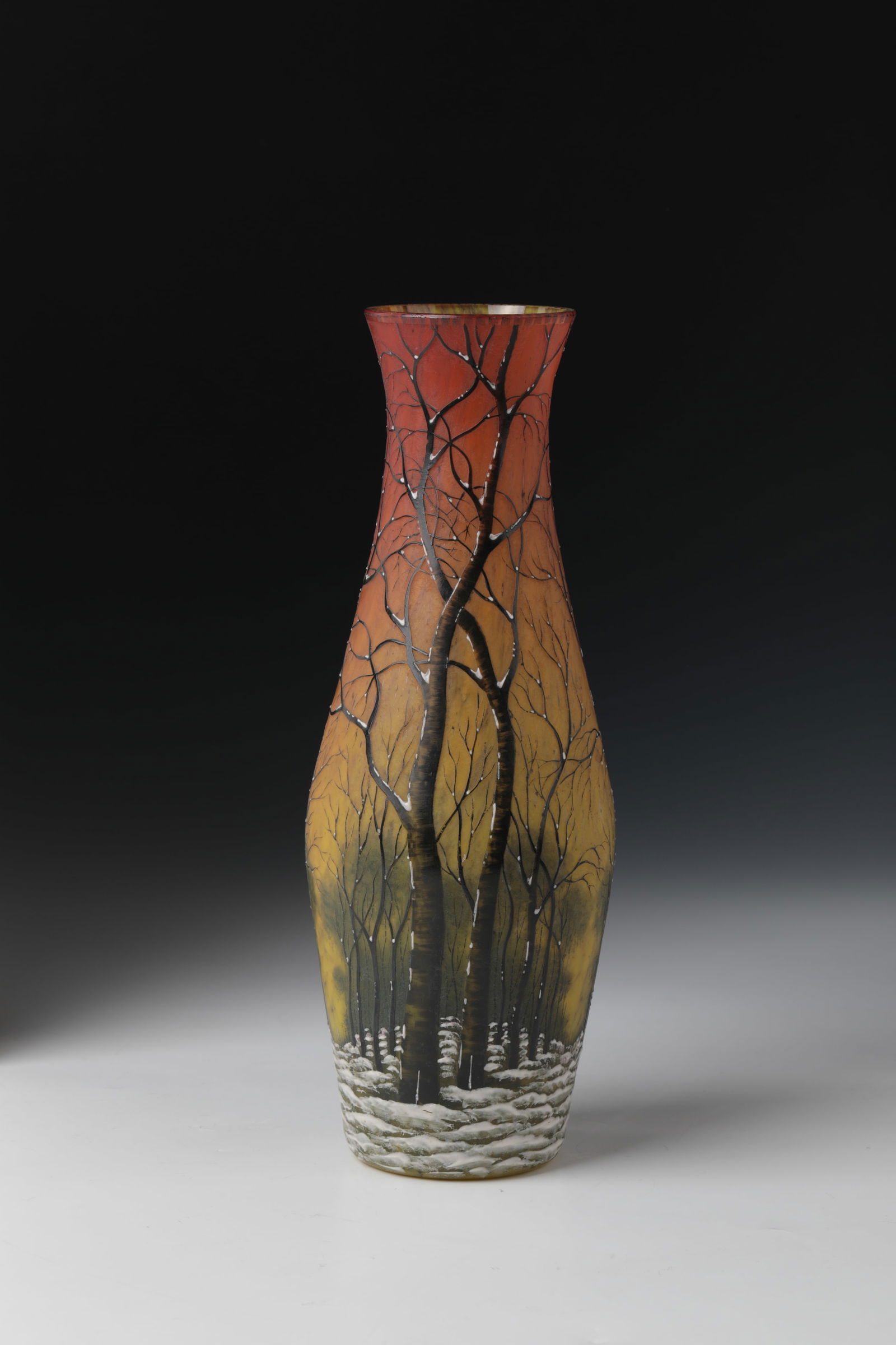 Vase with winter landscape ''Paysage hivers'': Vase with winter landscape ''Paysage hivers'' Daum Frères, Nancy, c. 1902 Colourless glass with multi-coloured powder melting. Circumferential relief, etched and colorful enameled décor. H. 26 cm