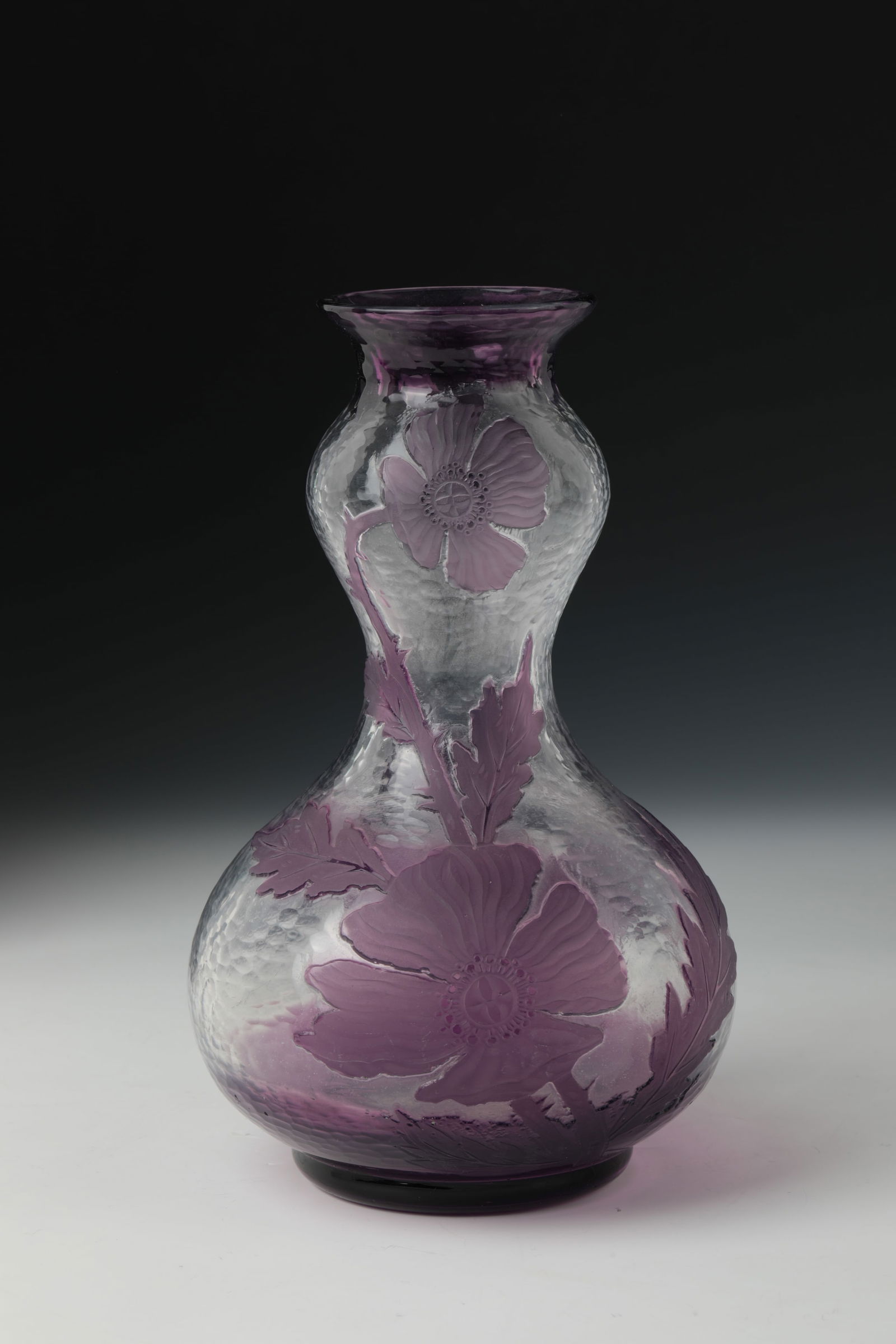 Double pumpkin vase with poppy seeds: Double Pumpkin Vase with Poppy Val Saint - Lambert, circa 1900 Colorless, violet overlaid glass with etched decoration. Almost the entire rear with polished Martelé cut. The entire décor section has