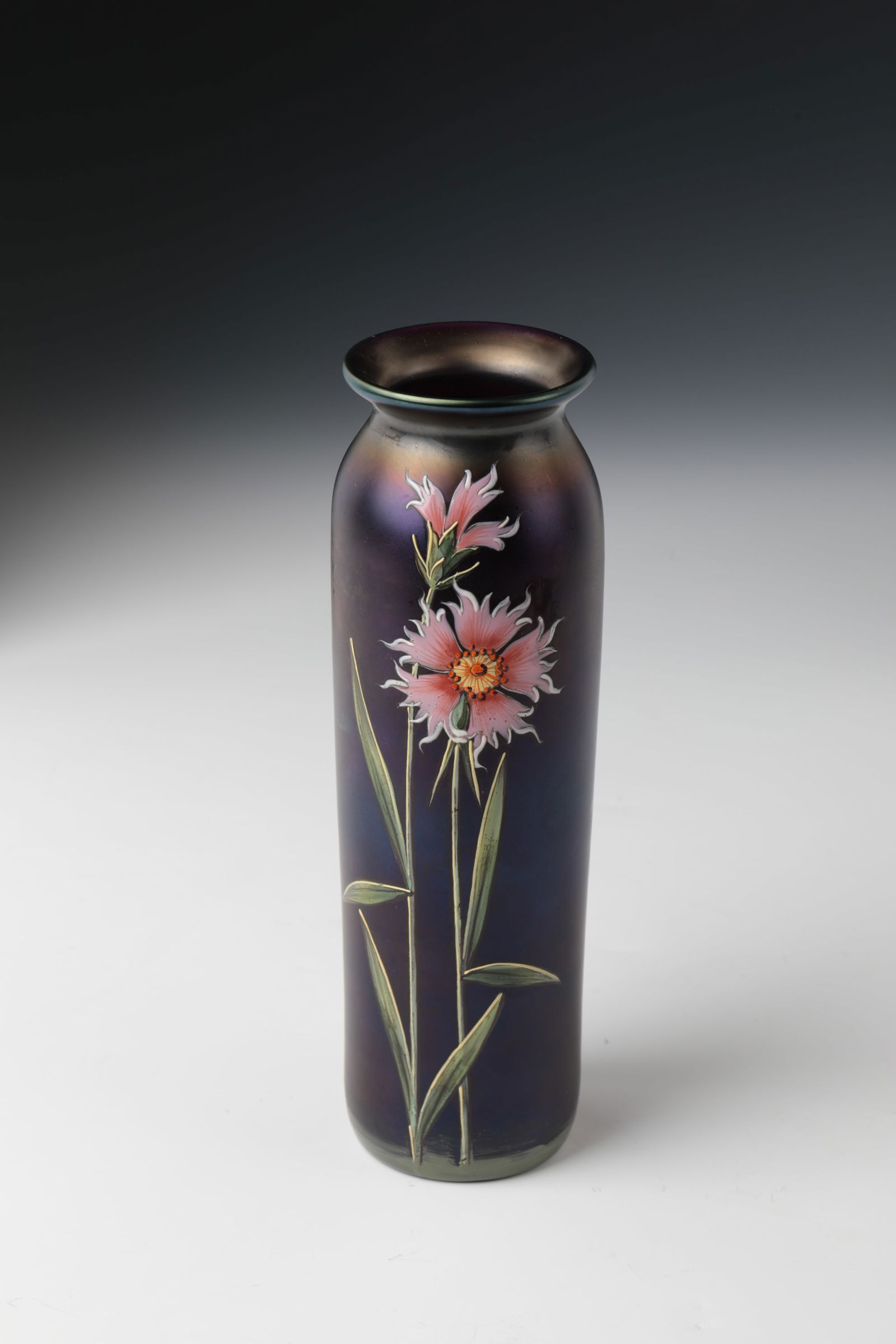 Rod vase with stone carnation: Rod vase with stone carnation Carl Schmoll von Eisenwert (design), Ferdinand von Poschinger, Glashüttenwerk Ilmenau, 1899 Dark violet glass with polychrome enamel painting: Blossoms. Buds and leaves