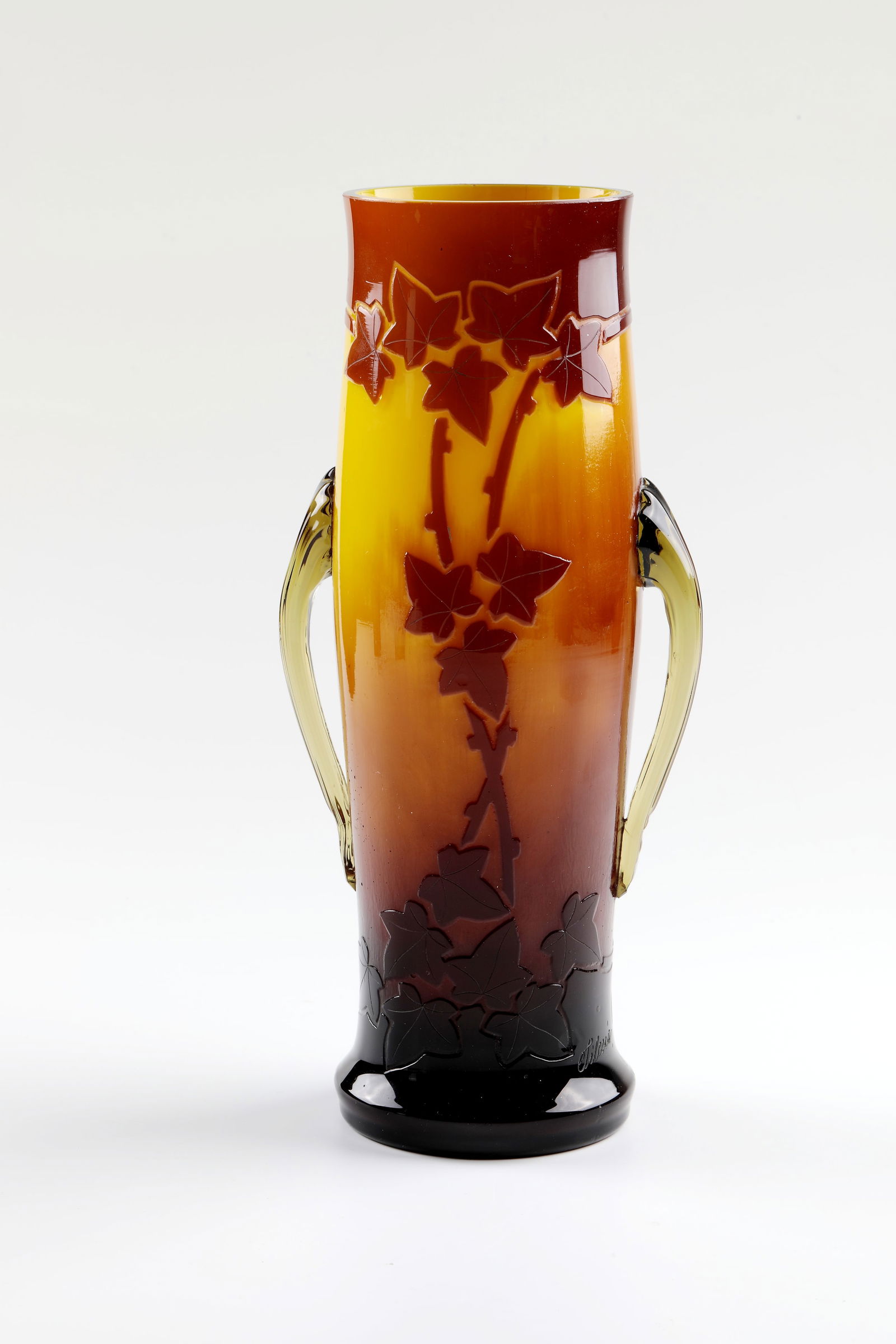 Vase: Vase Oranienhütte Seitenberg/Silesia, c. 1905/10 Colourless, opal-yellow underlaid glass with orange-brown overlay. Circumferential etched vine leaf décor. Handles melted at the sides. Signature in