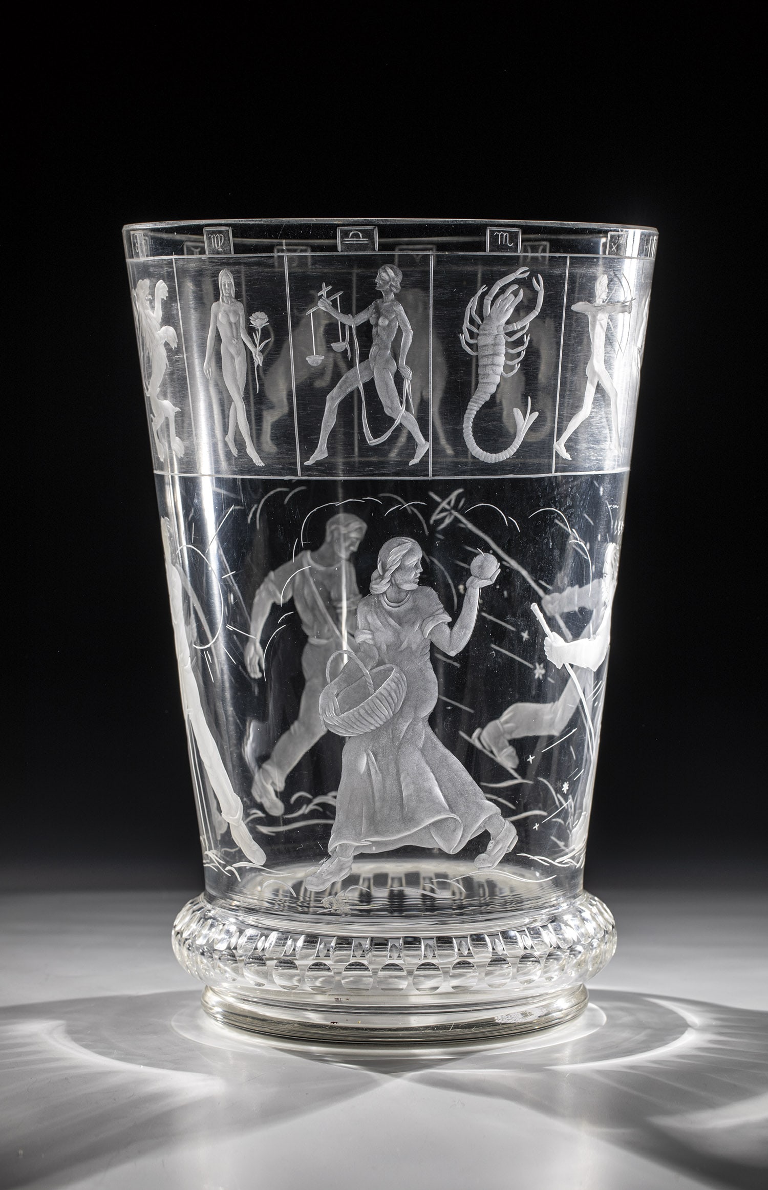 Vase: Vase Josef Moder, 1943 Colourless glass with finely executed, partly polished deep cut. Circumferential décor: allegories of the four seasons and the twelve signs of the zodiac. Above the stand cut d