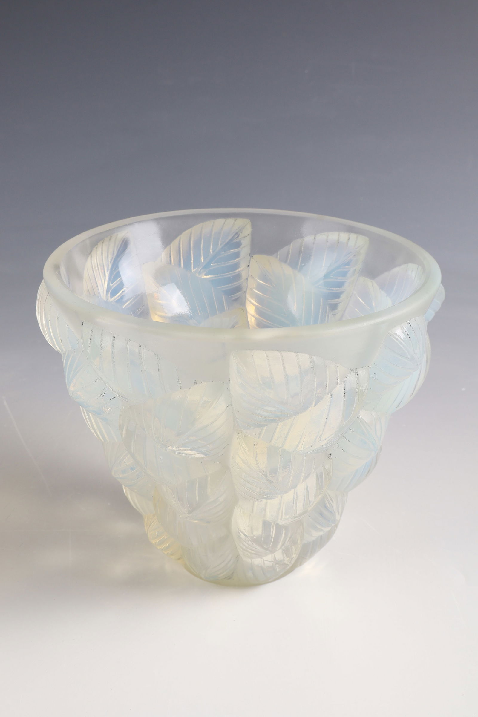 Vase ''Moissac'': Vase ''Moissac'' René Lalique, Wingen-sur-Moder, ca. 1927 Colourless pressed glass, opalescent, partially satin-finished. Circumferential décor in the form of sheets laid on top of each other and ar