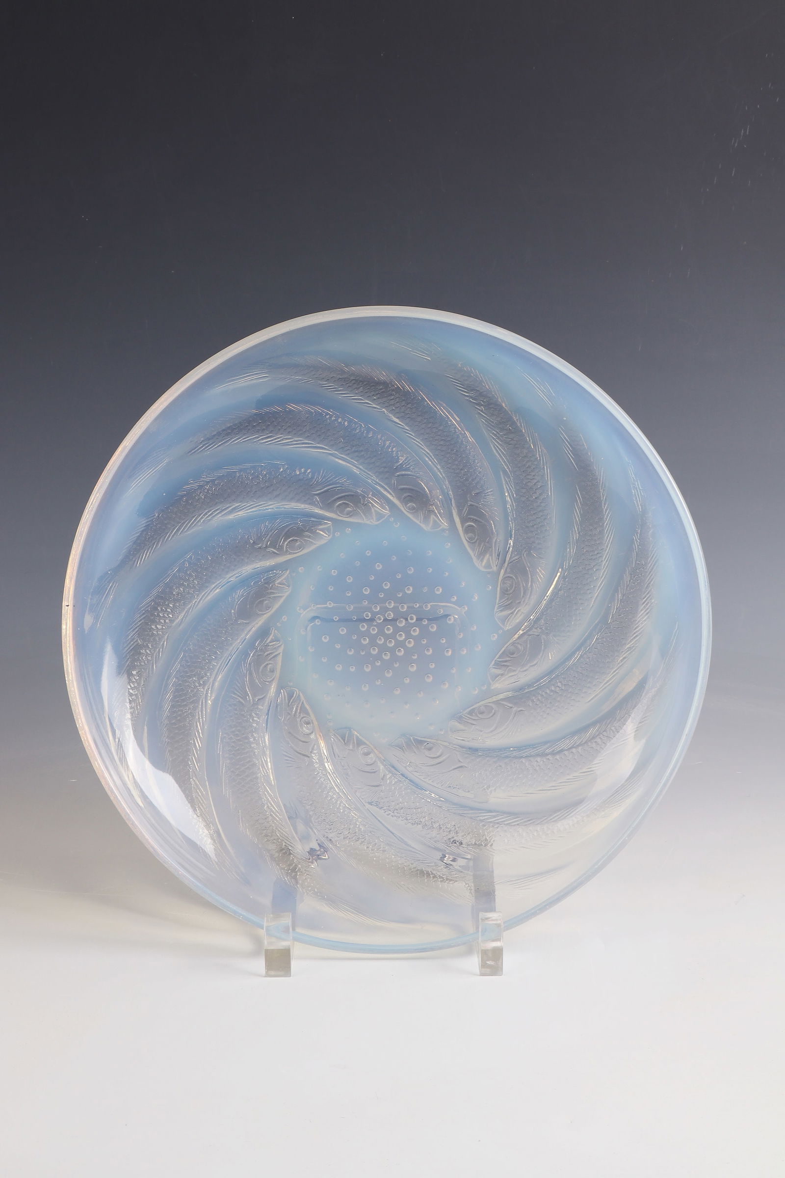 Bowl ''Poissons No 1'': Bowl ''Poissons No 1'' René Lalique, Wingen-sur-Moder, 1931 Colourless, partially opalescent glass, pressed into the mould, finished by polish. Relief décor: Fish in repeat. In the rear: R. LALIQUE