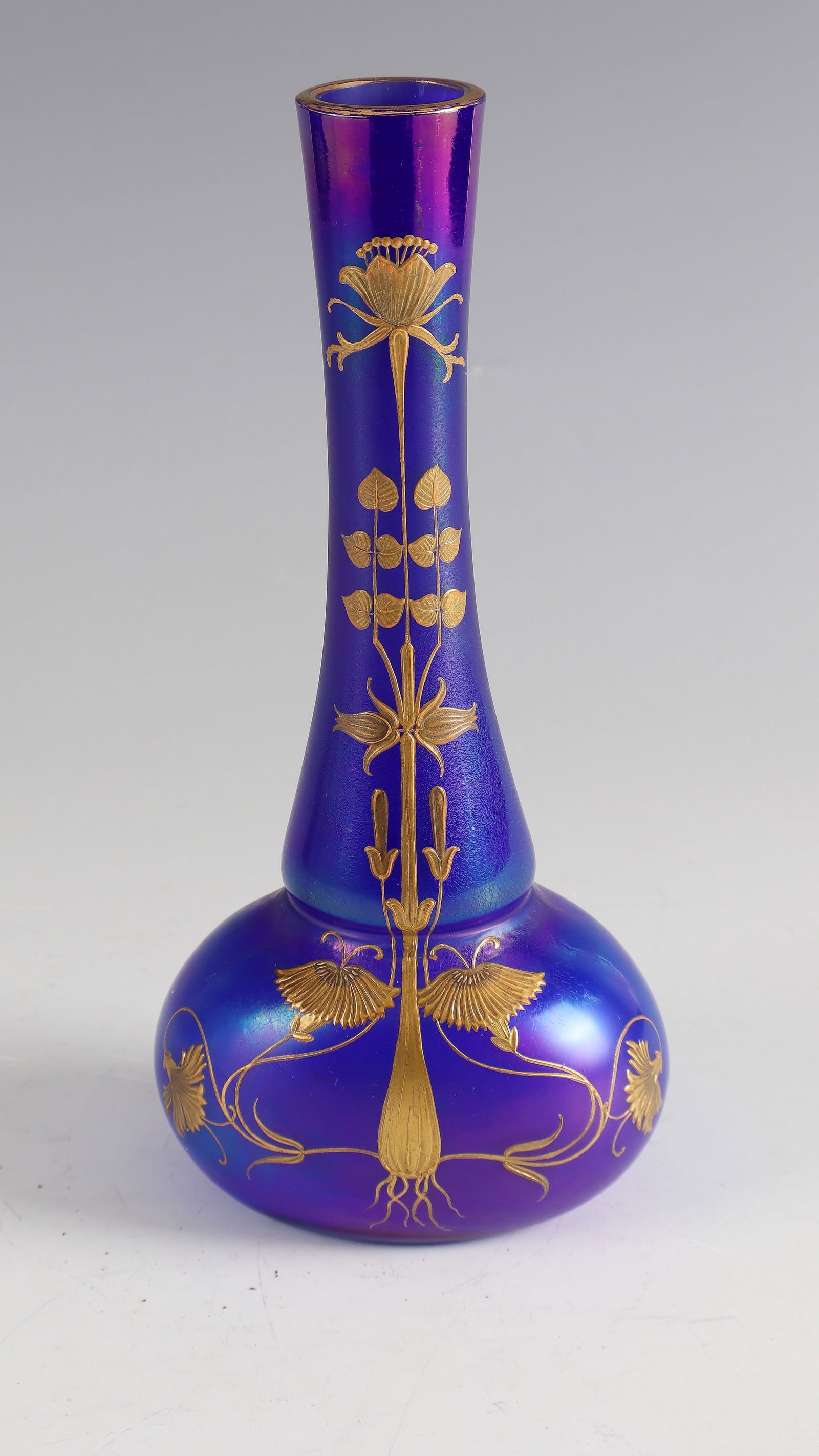 Long-neck vase: Long-neck vase Bohemia, c. 1900 Blue glass. On the bulbous wall, flattened on both sides, stylised floral décor in polished relief gold. In the bottom inscription: I. 965 45, 45/90 in white flat colo