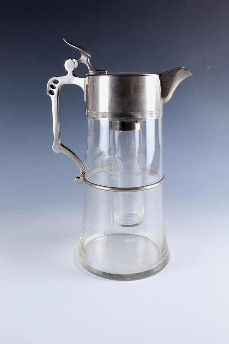 Carafe, so-called ''Cold Duck'': Carafe, so-called ''Cold Duck'' WMF, Geislingen, WMF, around 1920 Colourless glass with cut decoration, partly polished. Metal mount with side handle and handle. Cooling insert. Stamped in the lid