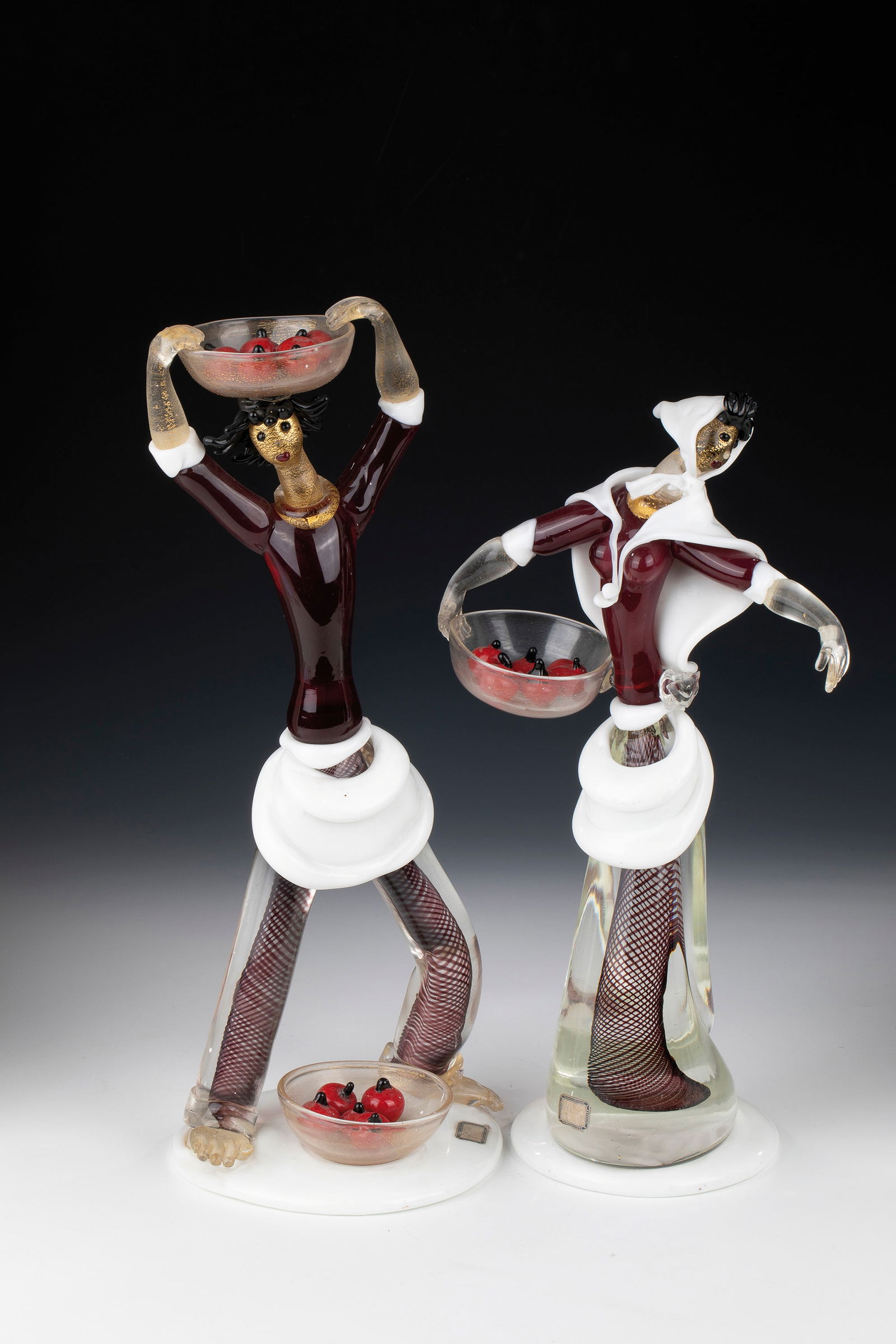 Pair of figures: Pair of figures Anzolo Fuga (design), Arte Vetreria Muranese (A.Ve.M.), Murano, 1956 Colourless, opaque white ('lattimo'), ruby red, red and black glass. Freely formed and fused together, partly