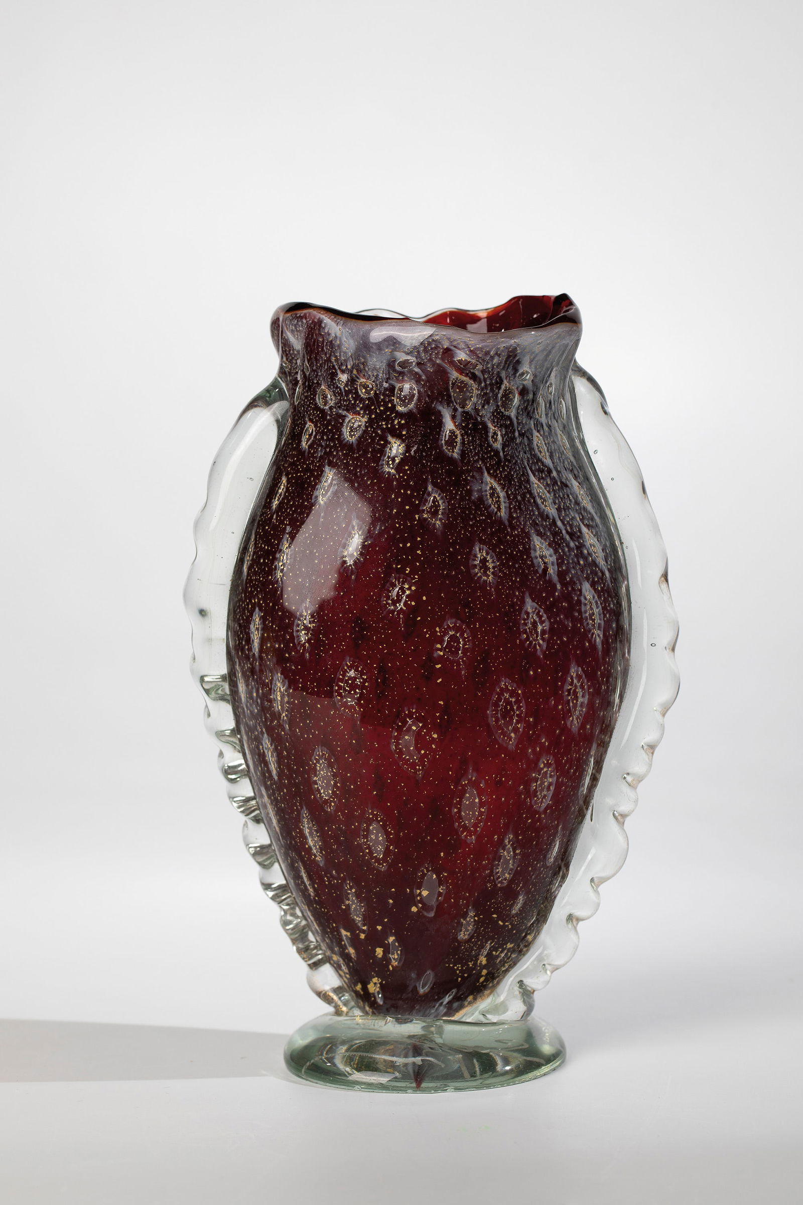 Vase: Vase Arte Vetreria Muranese (A.Ve.M.), Murano, c. 1955 Ruby red glass, colourless overlay. Air bubbles incorporated between the layers in a multi-row arrangement as well as sparse white streaks and