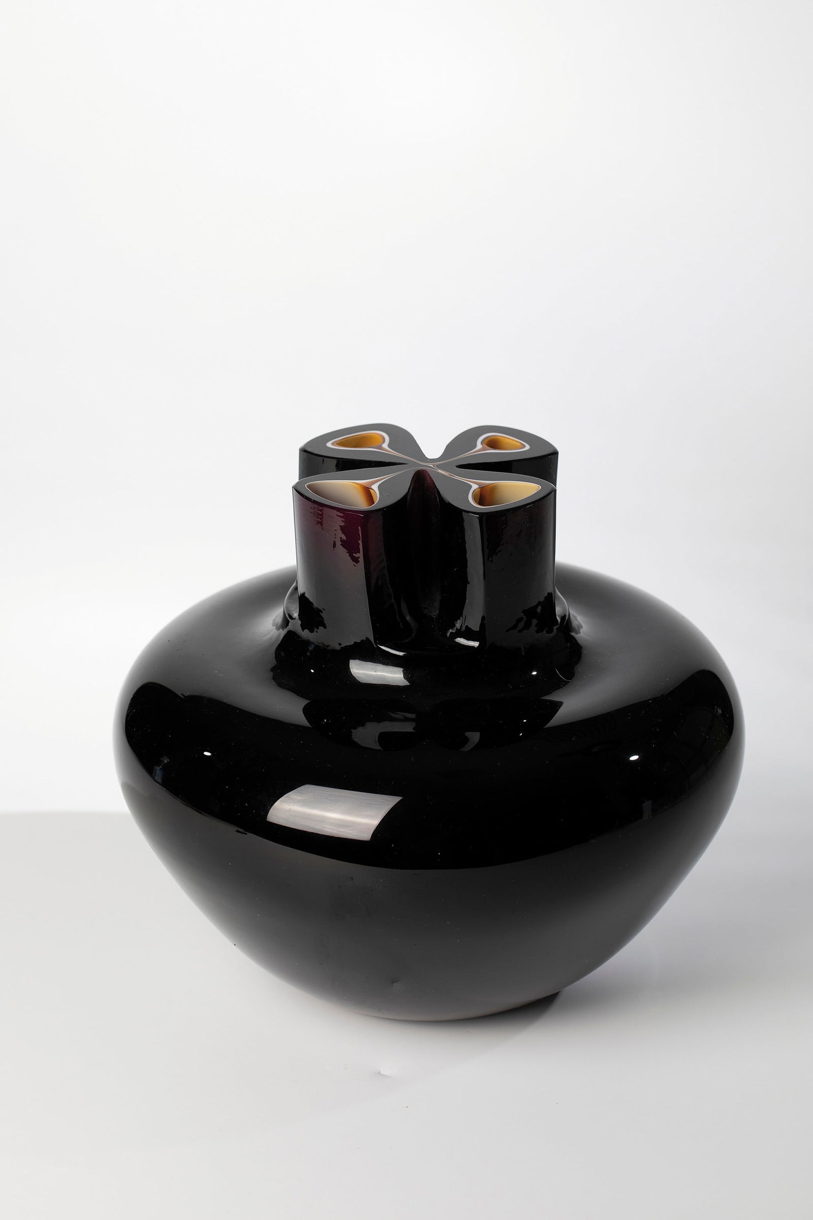 Vase: Vase Barbini for Pauly & C., Murano, circa 1980 Aubergine glass with underlays in opaque white and honey brown. Quadruple pressed muzzle. Above the stand inscribed in engraving: Barbini murano.