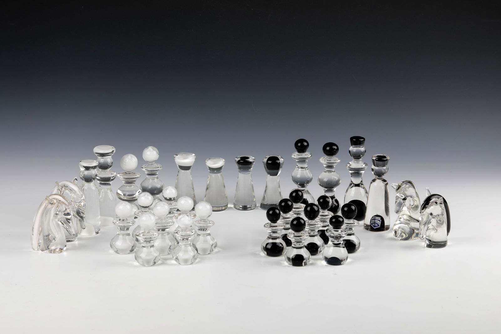 Chess Pieces Set: Chess Pieces Set Cenedese, Murano, 2nd H. 20th Century 32-piece chess pieces set. Colourless glass with black-violet or frosted glass inclusions ('lattimo'). A figure with original manufacturer's