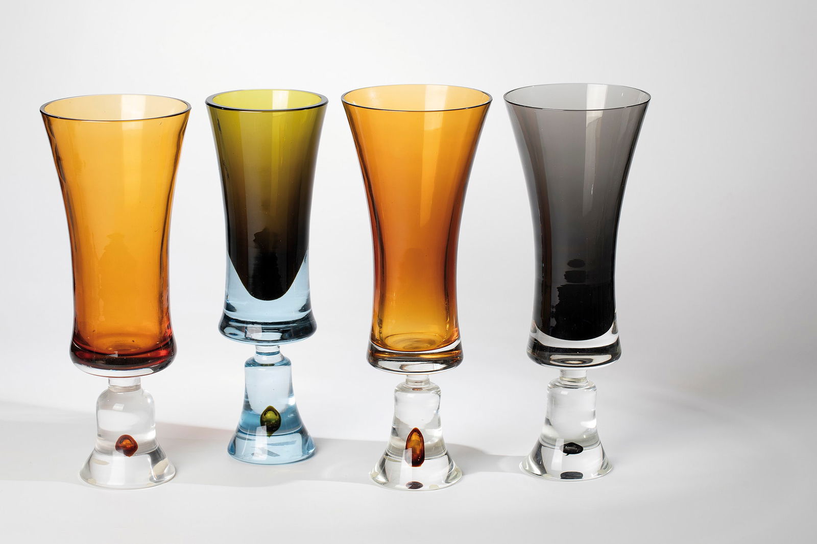 Four Vases ''Pagoda'': Four vases ''Pagoda'' Antonio Da Ros (design), Vetreria Gino Cenedese, Murano, c. 1964 Colourless glass with honey-brown, smoky grey or light green underlay. An engraved vase inscribes: Cenedese. H. 2