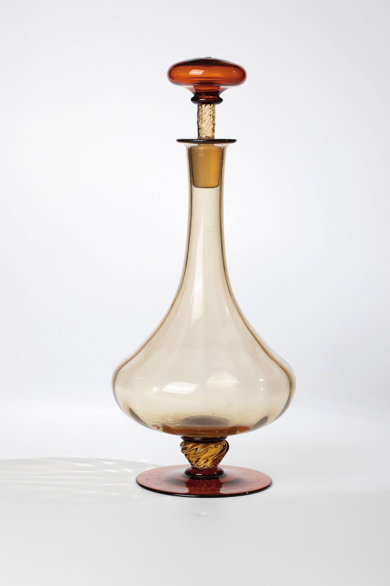 Bottle with stopper: Bottle with stopper Compagnia di Venezia e Murano - Pauly & C., Murano circa 1920-30 Smoky brown and honey brown glass. Bottle body, torsed nodus and shaft of the stopper ribbed optically blown. H.