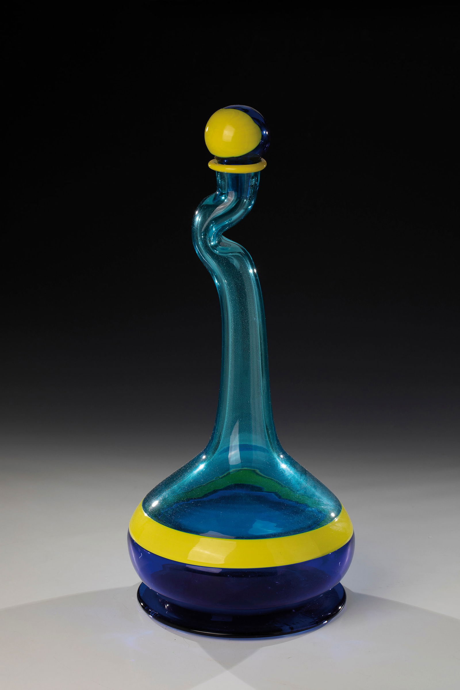 Bottle with stopper: Bottle with stopper Heinz Oestergaard (design), Salviati & C. (attributed) for Pauly & C., Murano, 1997 Dark and light blue as well as opaque yellow glass fused together in the 'Incalmo' technique.