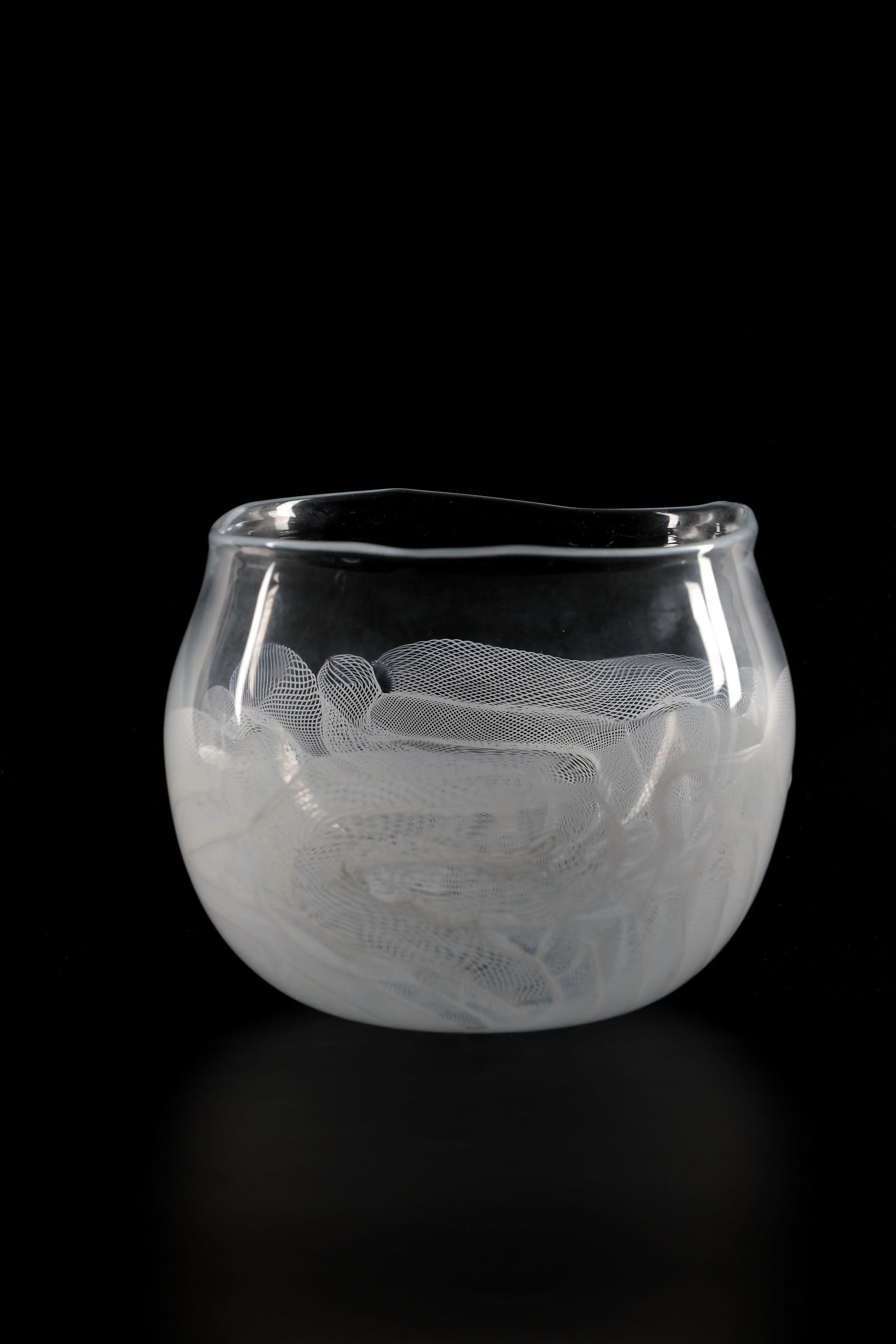 Vase ''Composizione lattimo'': Vase ''Composizione lattimo'' Archimede Seguso, Murano, 1954 Colourless glass with melted-in, finely wetted decoration ('mezza filigrana') in opaque white ('lattimo'). H. 13.5 cm; D. 19.5 cm.