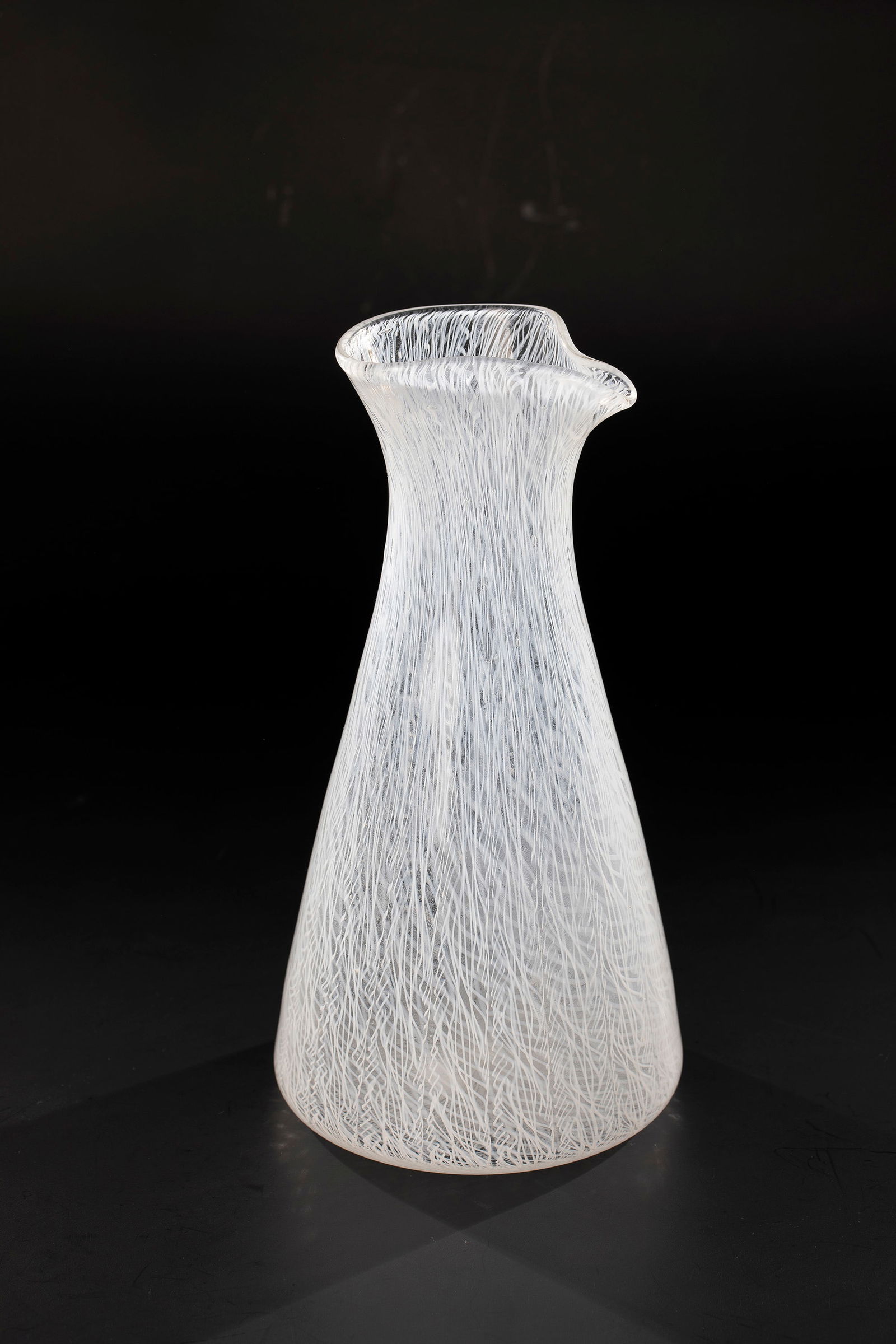 Carafe ''Merletto'': Decanter ''Merletto'' Seguso Vetri d'Arte, Murano, after 1960 Colourless glass, with melted white mesh decoration 'merletto'. H. 27.5 cm. Please note that items marked with an asterisk in the catalog