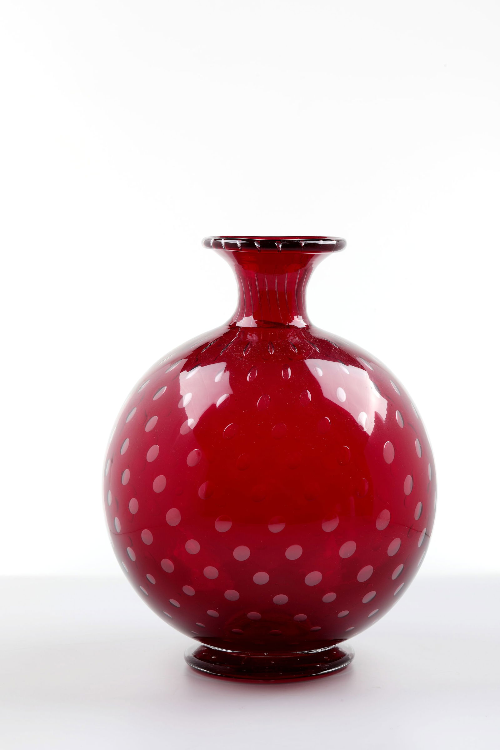Vase ''a bolle'': Vase ''a bolle'' Venini, Murano, c. 1950 Colourless glass, ruby red underlaid with air bubbles incorporated in several rows. Inscribed on the bottom: venini murano ITALIA (3-line etching stamp). H. 25