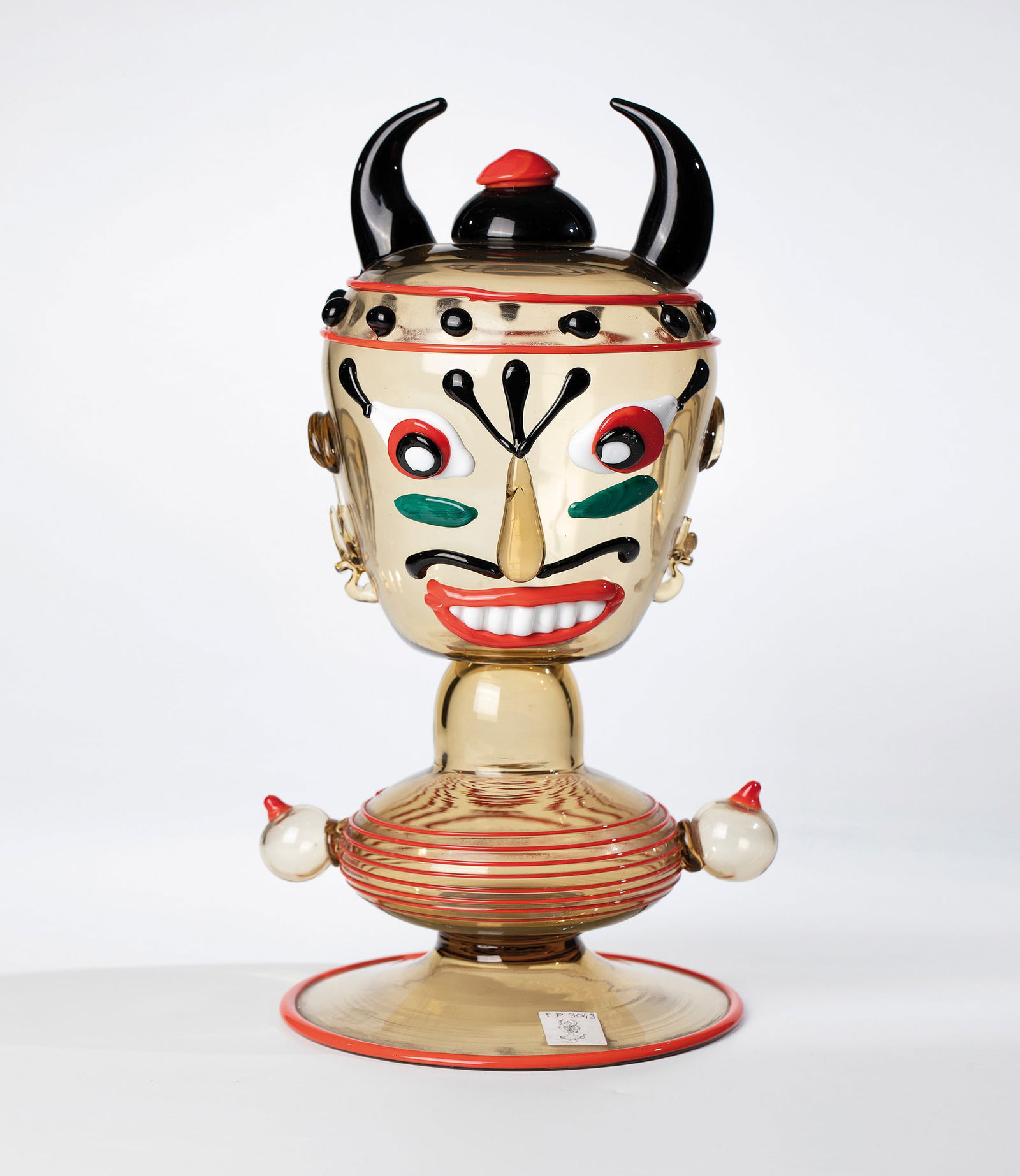 Grotesque figure ''Testa di Carnevale'': Grotesque figure ''Testa di Carnevale'' Franz Prati (design), Venini & C. (execution) for Compagnia di Venezia e Murano - Pauly & C., Murano, 1988/89 Honey-yellow glass with melting in opaque red,