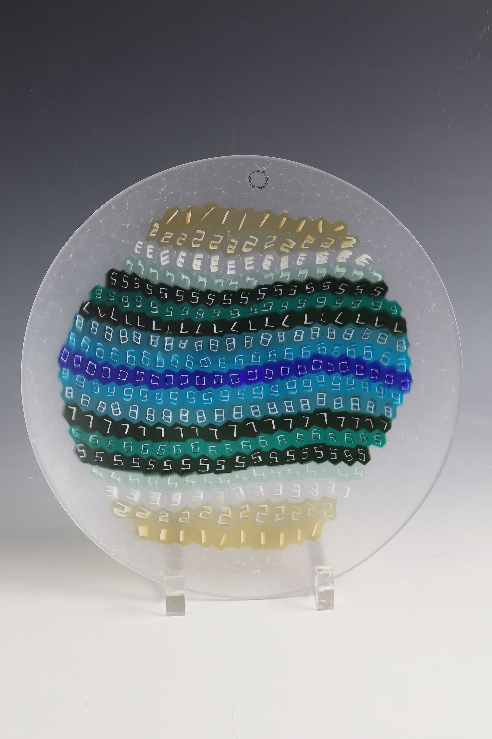 Plate ''Murrina dei Numeri'': Plate ''Murrina dei Numeri'' Laura de Santillana (design) 1975, Venini, Murano, 1996 (execution) Flat hollowed plate made of fused murrine in clear and coloured glass. On both sides with delicate carv