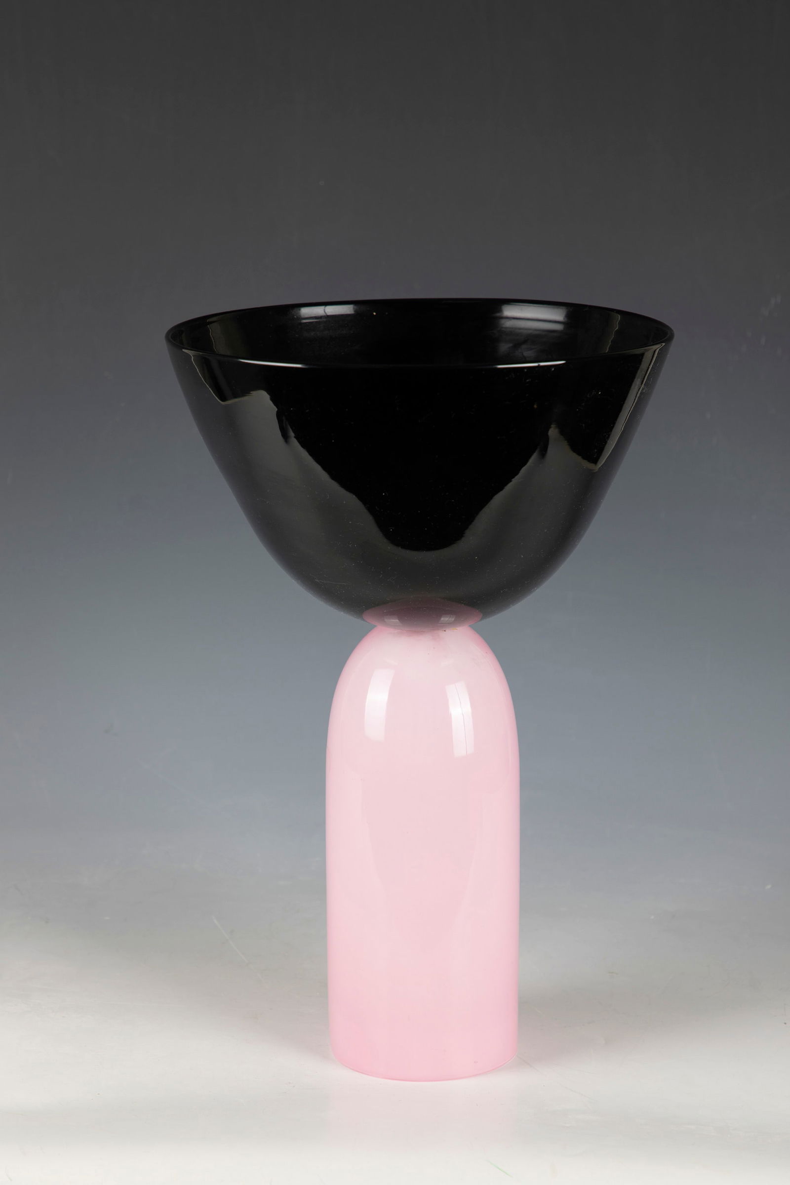 Object: Object Vistosi, Murano, 1980s Pink opal glass, colorless overlay and black glass. Merged. H. 37.5 cm. Please note that items marked with an asterisk in the catalog are subject to standard VAT. For