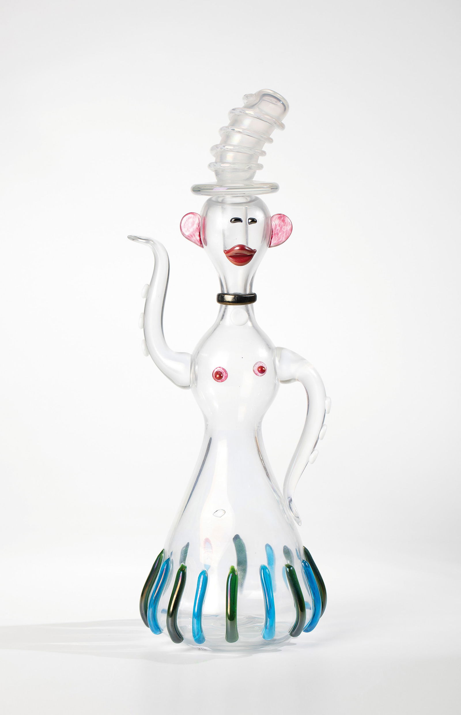 Figurative Bottle Object: Figurative bottle object Fulvio Bianconi (design), Vetreria Zanetti, Murano, before 1970 Colourless glass with fused pieces of glass in opaque white, blue, green and pink, (with crumb melting).