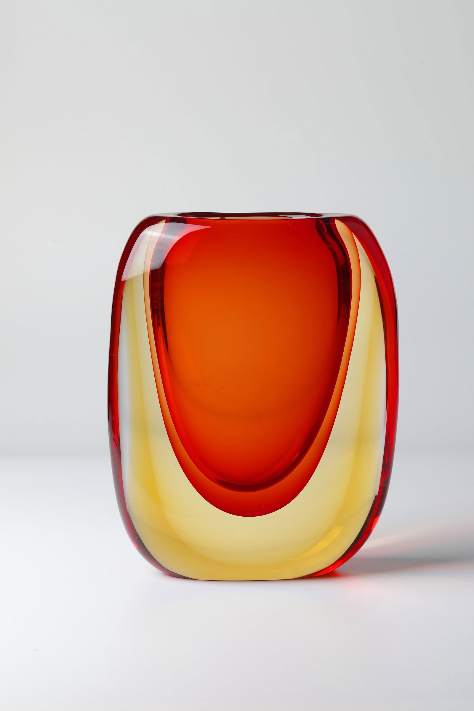 Vase ''Sommerso'': Vase ''Sommerso'' Simone Mian, Formia Vetri di Murano, Murano, c. 1980 Colourless, thick-walled glass with underlays in ruby red and honey yellow. Inscribed in the booth: Simone Mian (engraved). H.