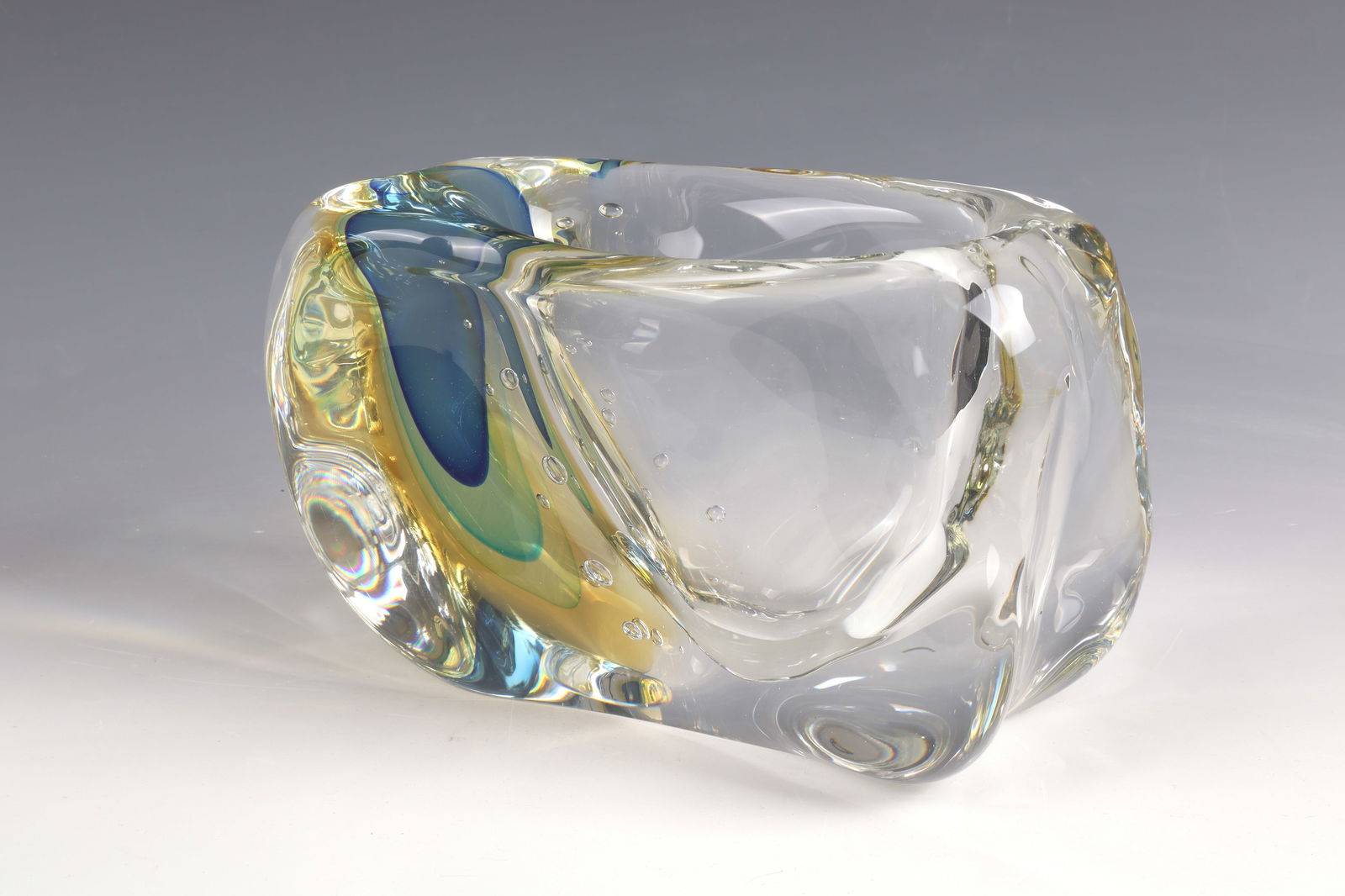 Vase object: Vase object Luigi Onesto, Vetreria Artistica Oball, Murano, 1970s Colorless, thick-walled glass. Streak-like meltings in blue, yellow and green, with incorporated air bubbles. Vibro-engraved