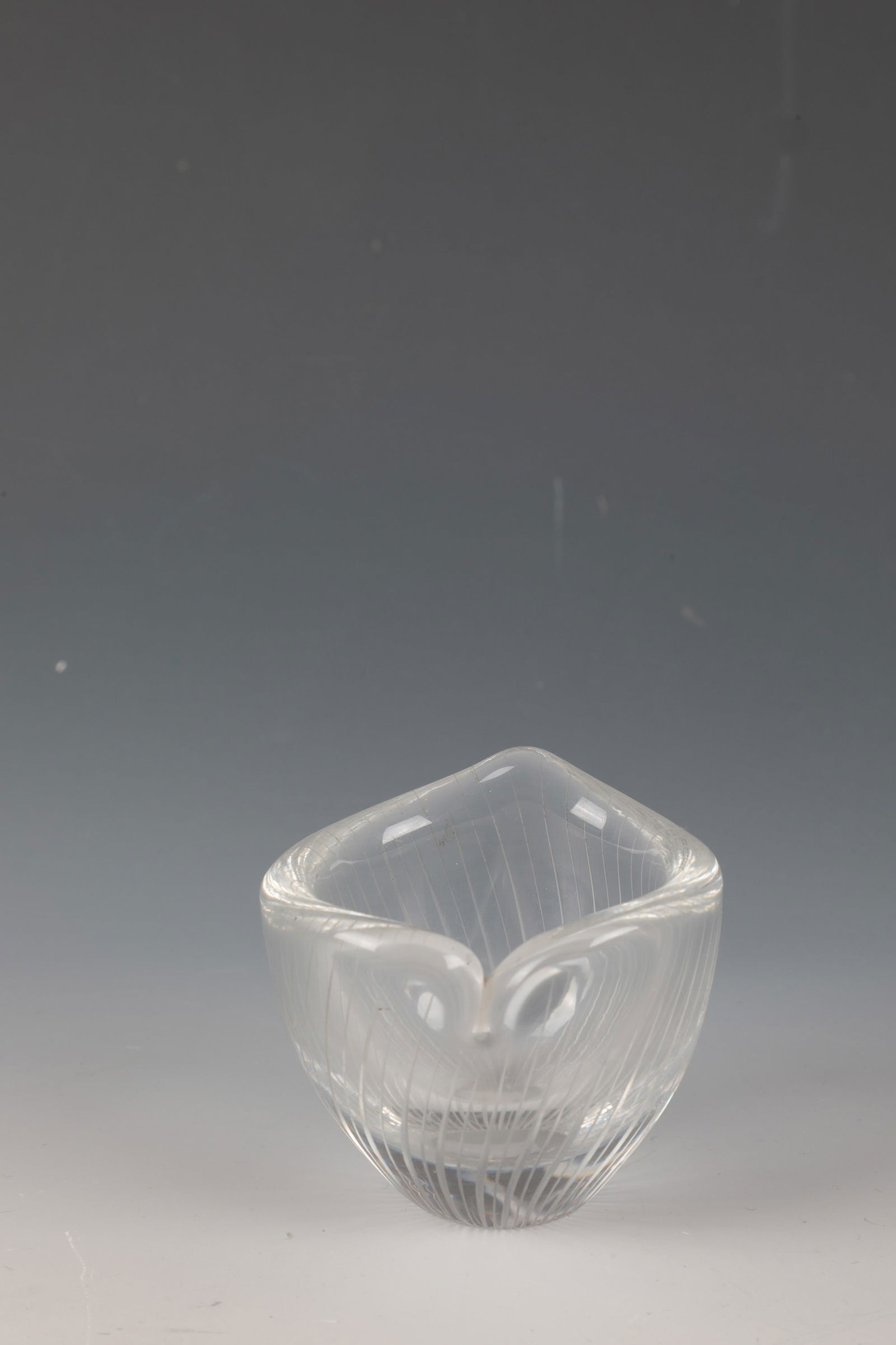 Small vase ''Kantarelli'': Small vase ''Kantarelli'' Tapio Wirkkala (design) 1947, Iittala (execution), 1957 Colourless glass. Circumferential with vertical lines in matt engraving. In diamond plan inscribed: TAPIO WIRKKALA -