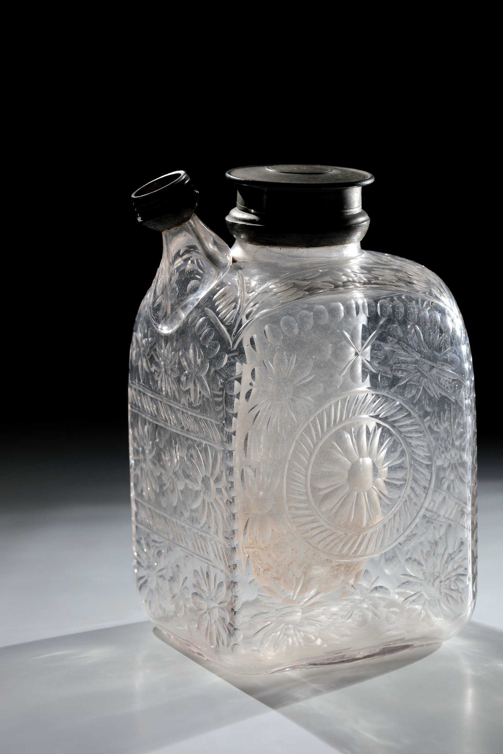 Rare Rectangle Bottle: Rare rectangular bottle Germany or Bohemia, 1st half of the 18th century Colourless, slightly greyish tinted glass. Bottom with polished tear-off and olive-cut decoration. On the cross-sectional recta