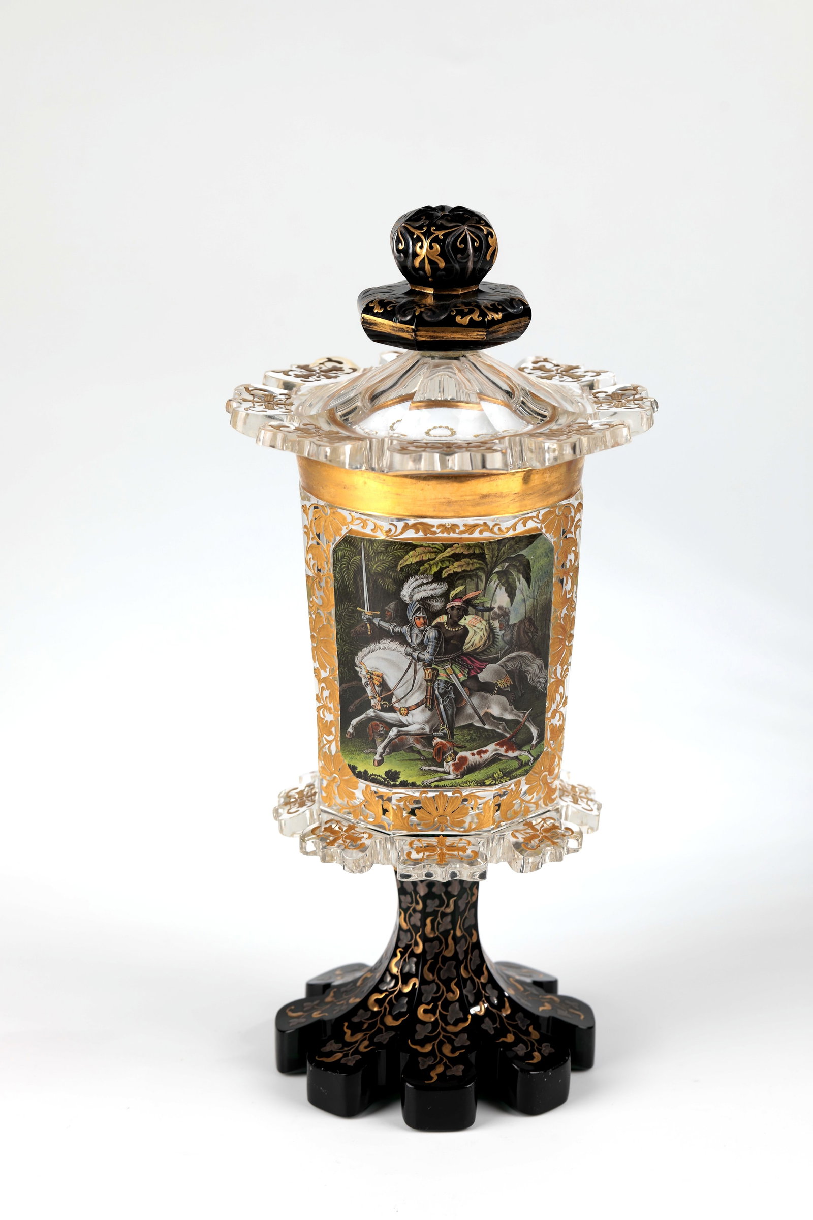 Lidded goblet depicting the explorer Alonso de Ojeda: Lidded goblet with depiction of the explorer Alonso de Ojeda North Bohemia, M. 19th century. Base and pommel made of Russian green, cuppa and lid made of colourless glass. On the upper side of the pas