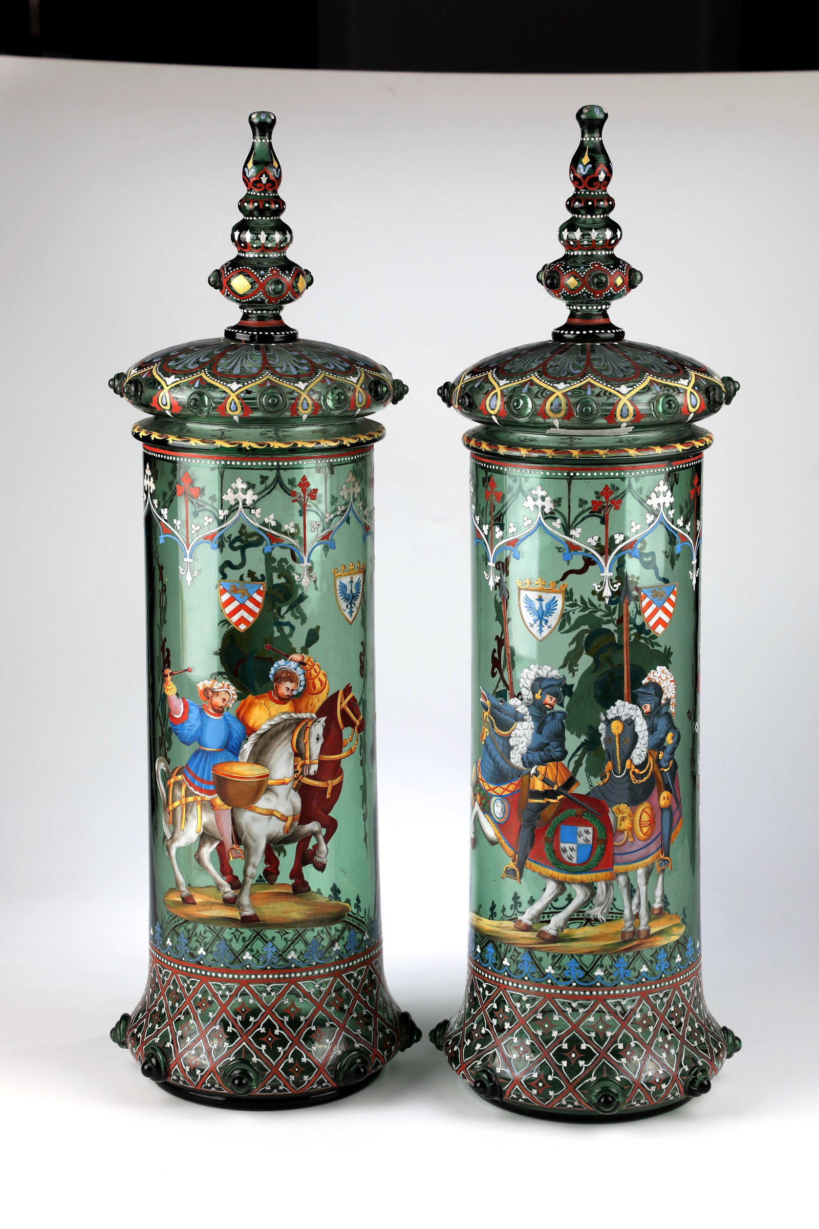 Pair of monumental lidded tankards: Pair of monumental lidded tankards Harrach'sche Glasfabrik, Neuwelt, c. 1870 Green glass. Approach of the slightly tapered body with eight applied nubs and orientalising diamond decoration in white an