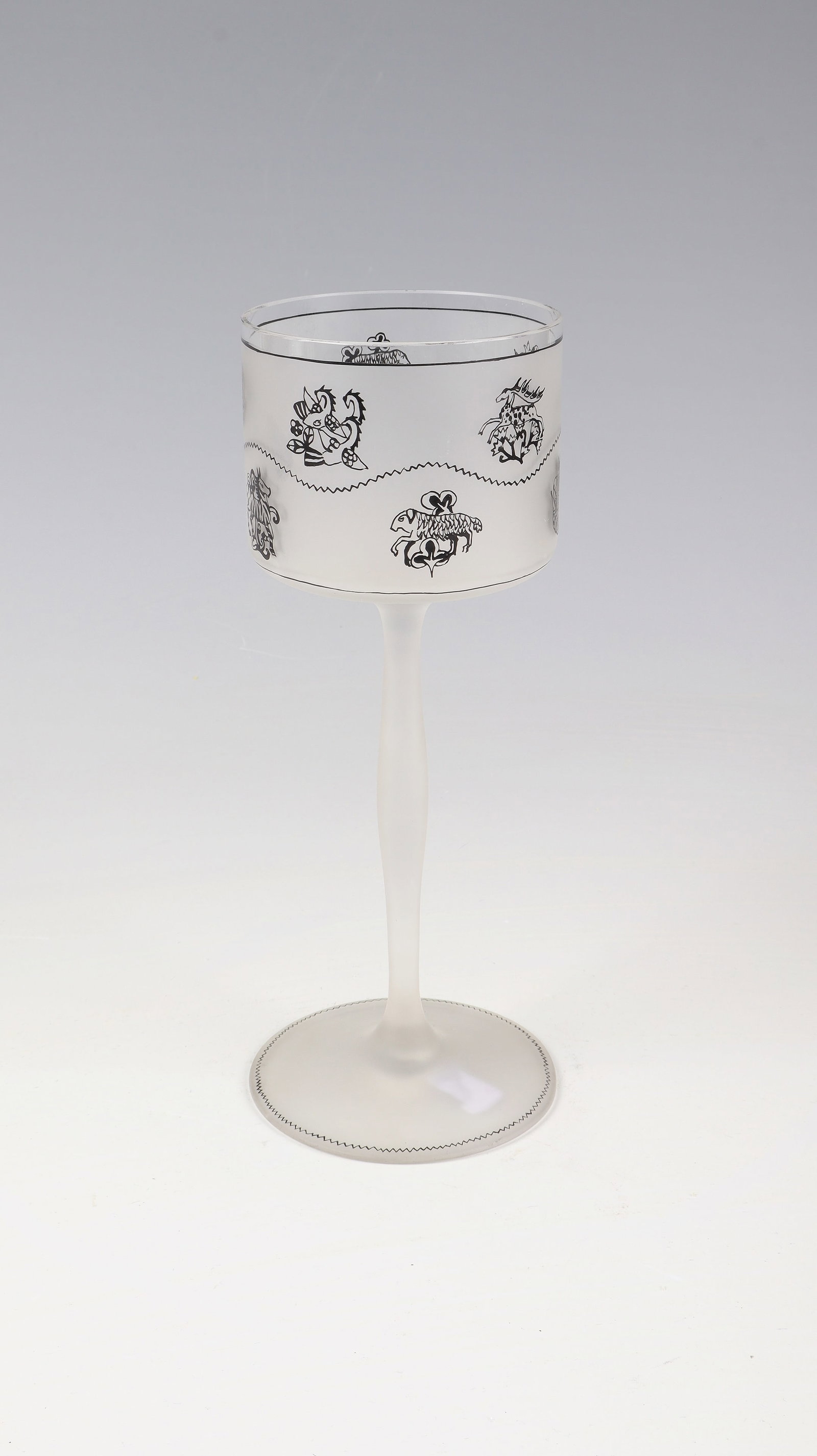 Rare wine glass with mythical creatures: Rare wine glass with mythical animals Ludwig Heinrich Jungnickel (form), Carl or Paul Thomas (décor) for J. & L. Lobmeyr, Vienna, before 1914 Colorless, semi-gloss etched glass with black solder