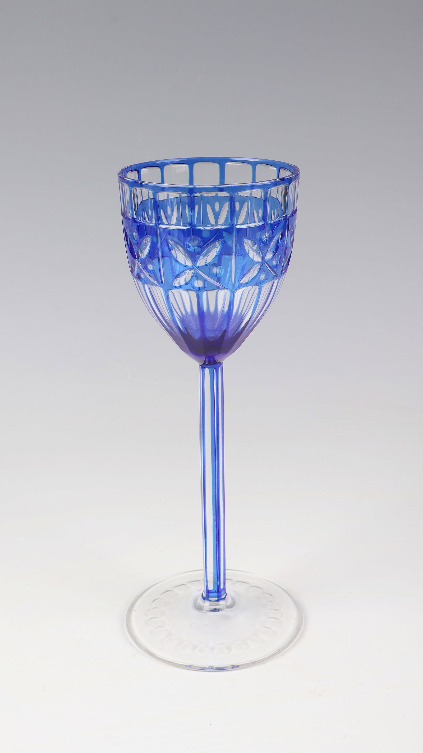 Wine glass: Otto Prutscher wine glass (design), Meyr's nephew, Adolfhütte near Winterberg (execution) for E. Bakalowits Söhne Vienna, c. 1906 Colourless, cobalt blue overlaid glass with peel cut. The cuppa