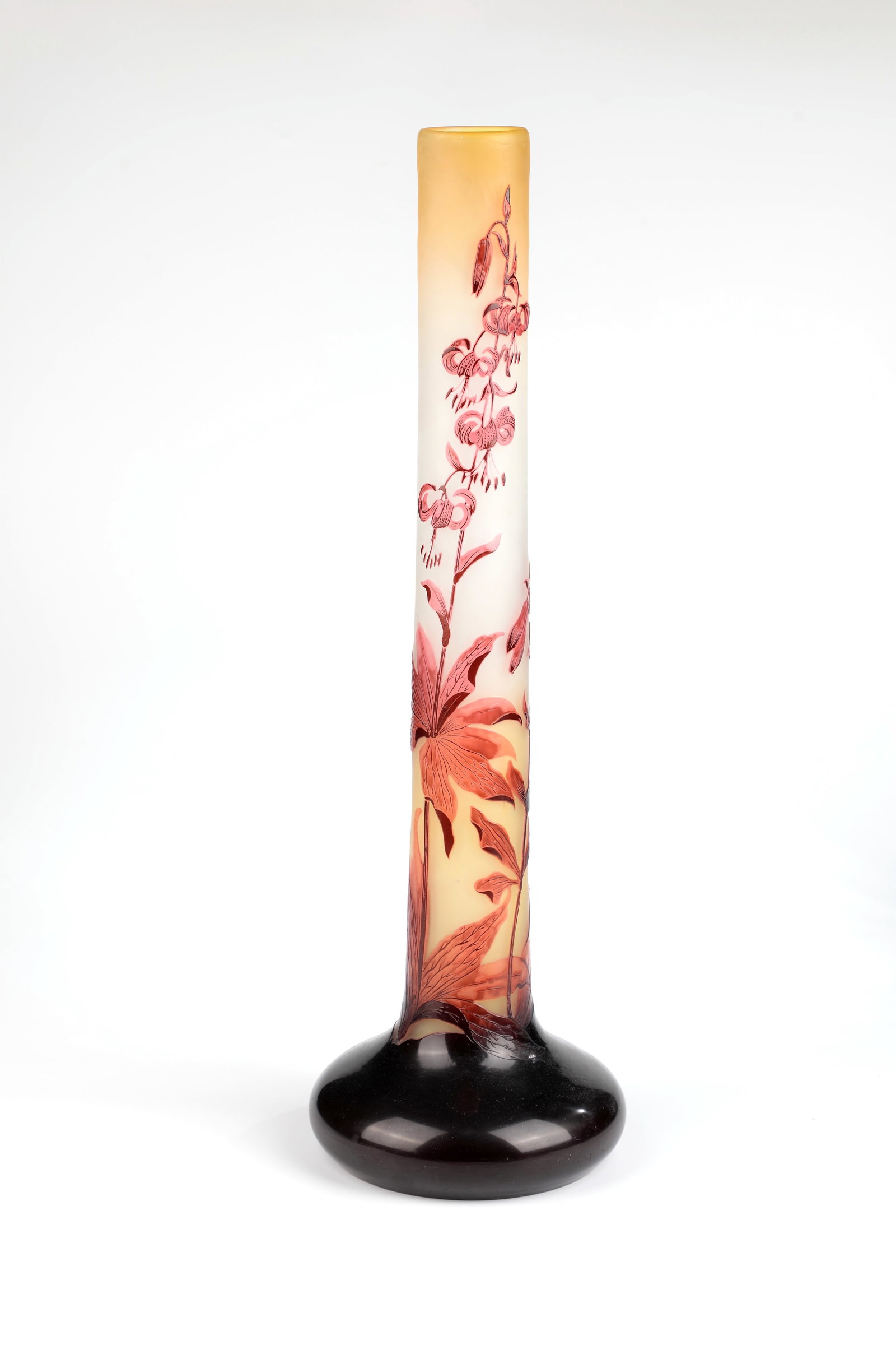 Floor vase with Turk's bunch lily: Floor vase with Turk's bundle lily Etablissements Gallé, Nancy, c. 1906-14 Colourless glass, lemon yellow underlay and red overlay. Etched decoration in relief all around: flowers, buds and foliage