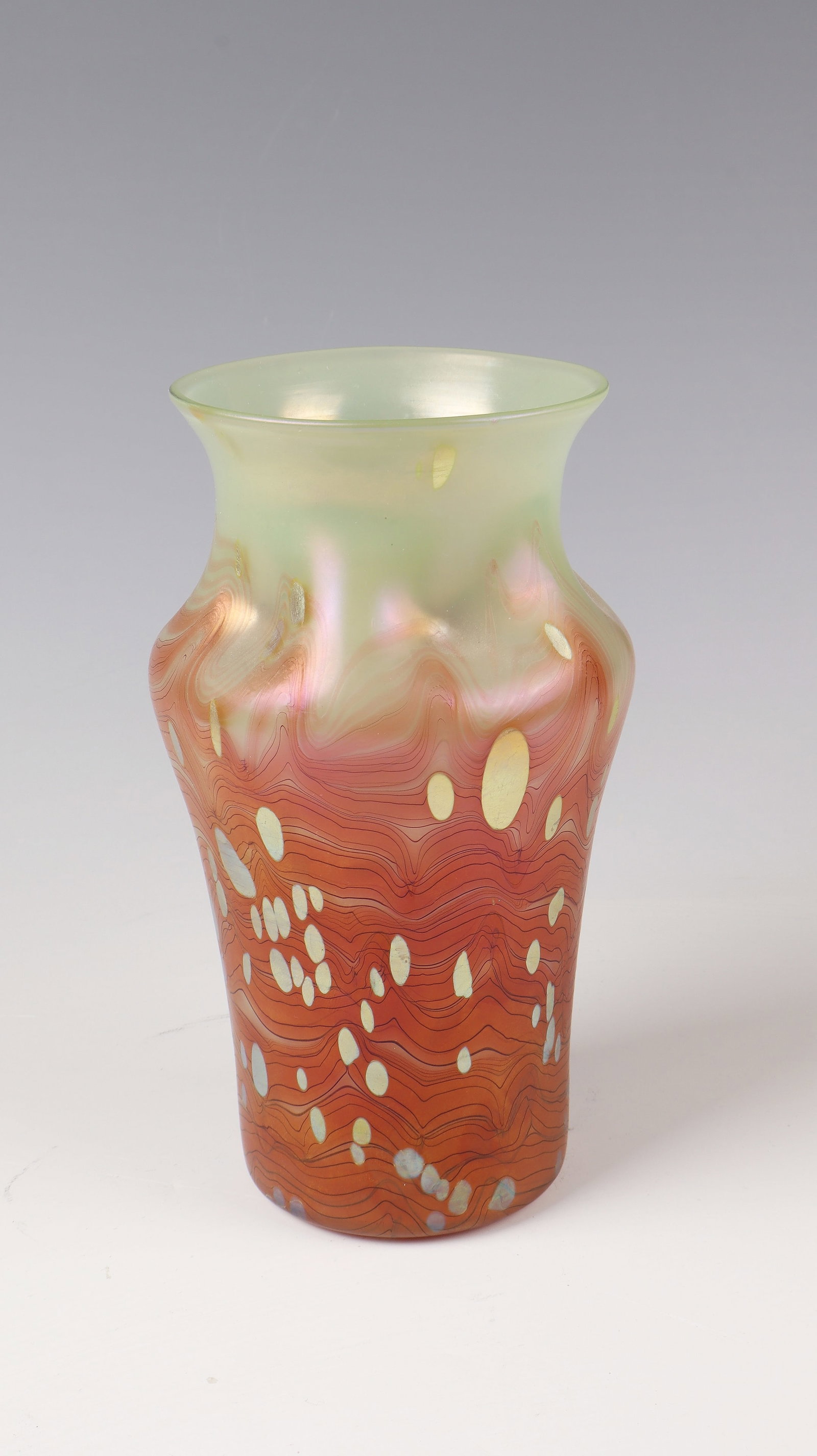 Vase ''May Green Cytisus'': Vase ''Maigrün Cytisus'' Loetz Wwe., Klostermühle, 1902 Colourless glass underlaid with light green opal. Braided with salmon-coloured, ruby-red veined ribbons, irregularly warped, silver-yellow dot