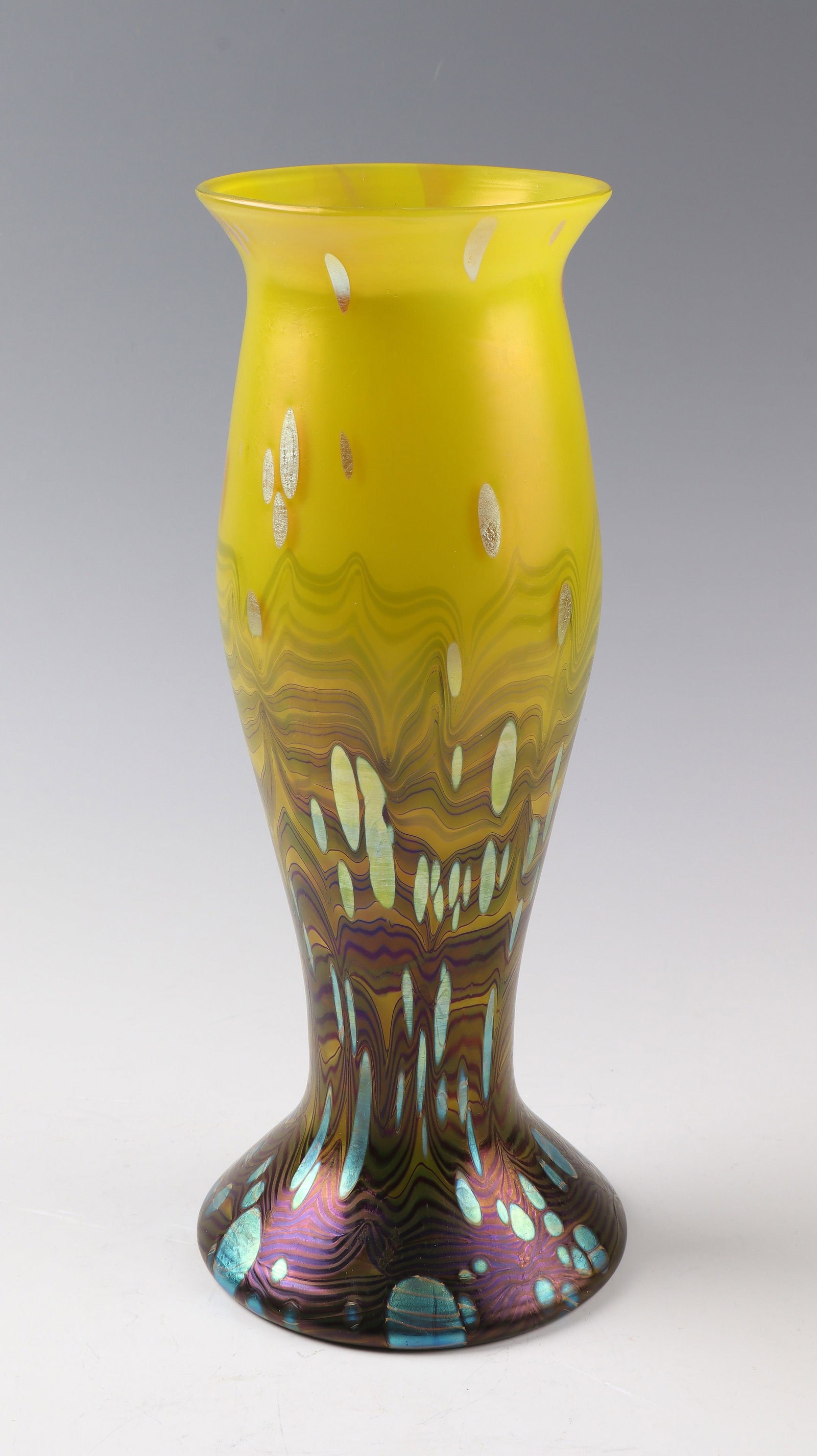 Vase ''Lemon Yellow Cytisus'': Vase ''Lemon Yellow Cytisus'' Loetz Wwe., Klostermühle, 1902 Colourless glass, underlaid with yellow opal inside. Densely wound with blue, reddish-brown veined stripes. Overlaid with irregularly