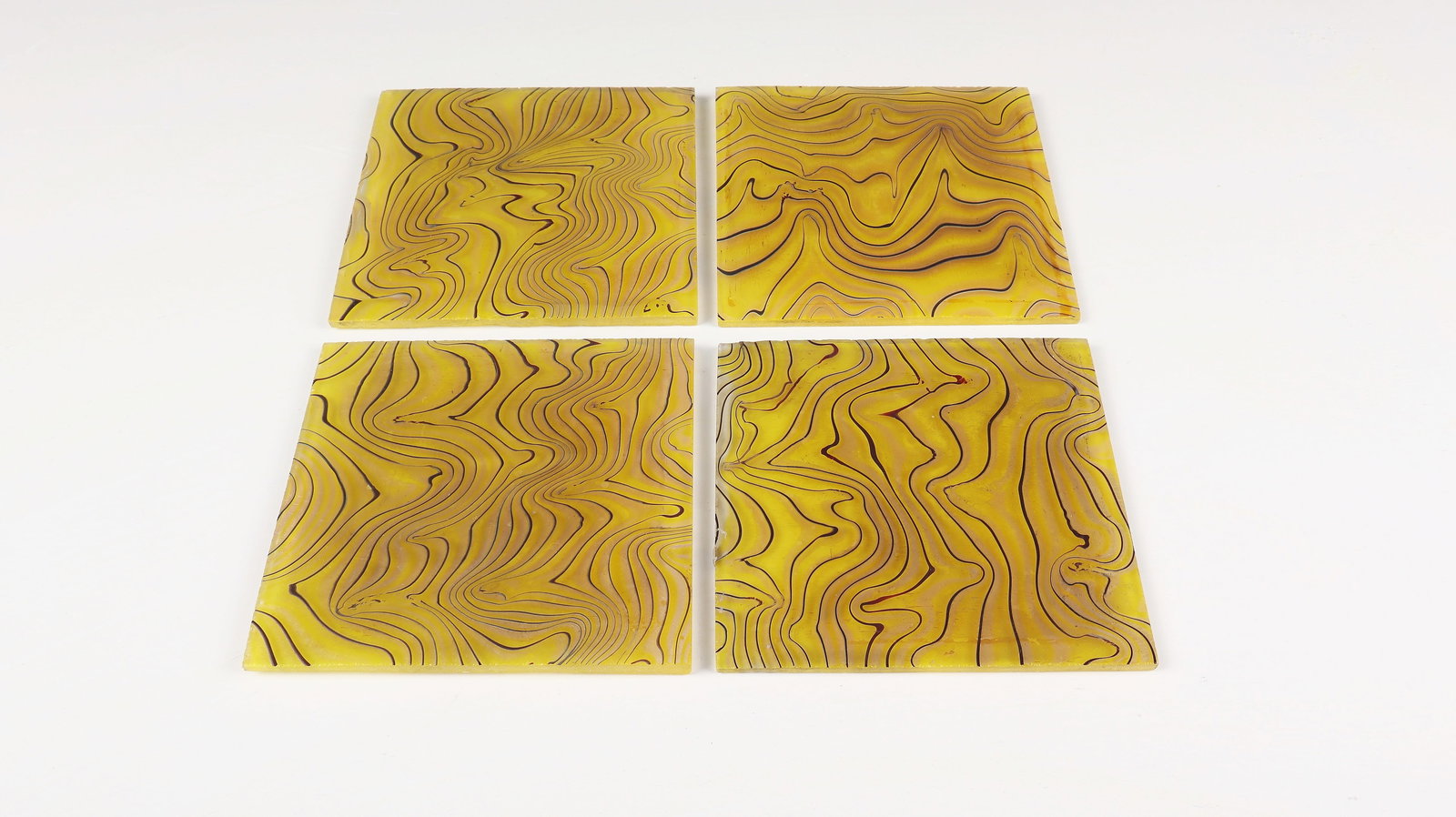 Four Rare Pattern Plates ''Metal Yellow Phenomenon 85/3710'': Four rare pattern plates ''Metal yellow phenomenon 85/3710'' Loetz Wwe., Klostermühle, around 1900 Colourless glass, yellow underlay. Covered with thin reddish-brown and silver threads and