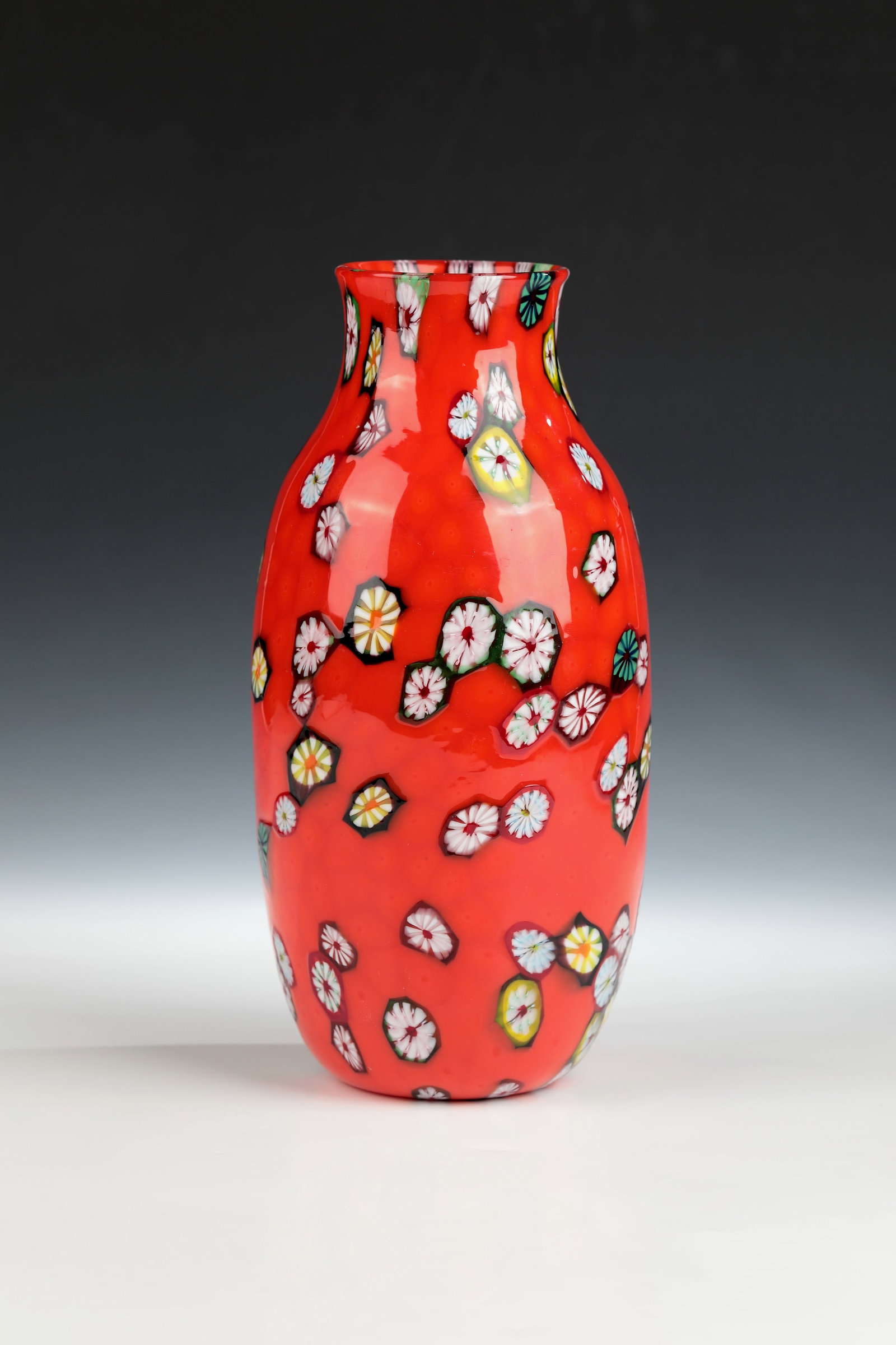 Vase ''Murrine sparse su fondo rosso'': Vase ''Murrine sparse su fondo rosso'' Ermanno Toso (draft), Fratelli Toso, Murano, 1950-55 Different and multi-coloured murrine ('Kiku' & 'Redentore') scattered on a base of melted red murrine.