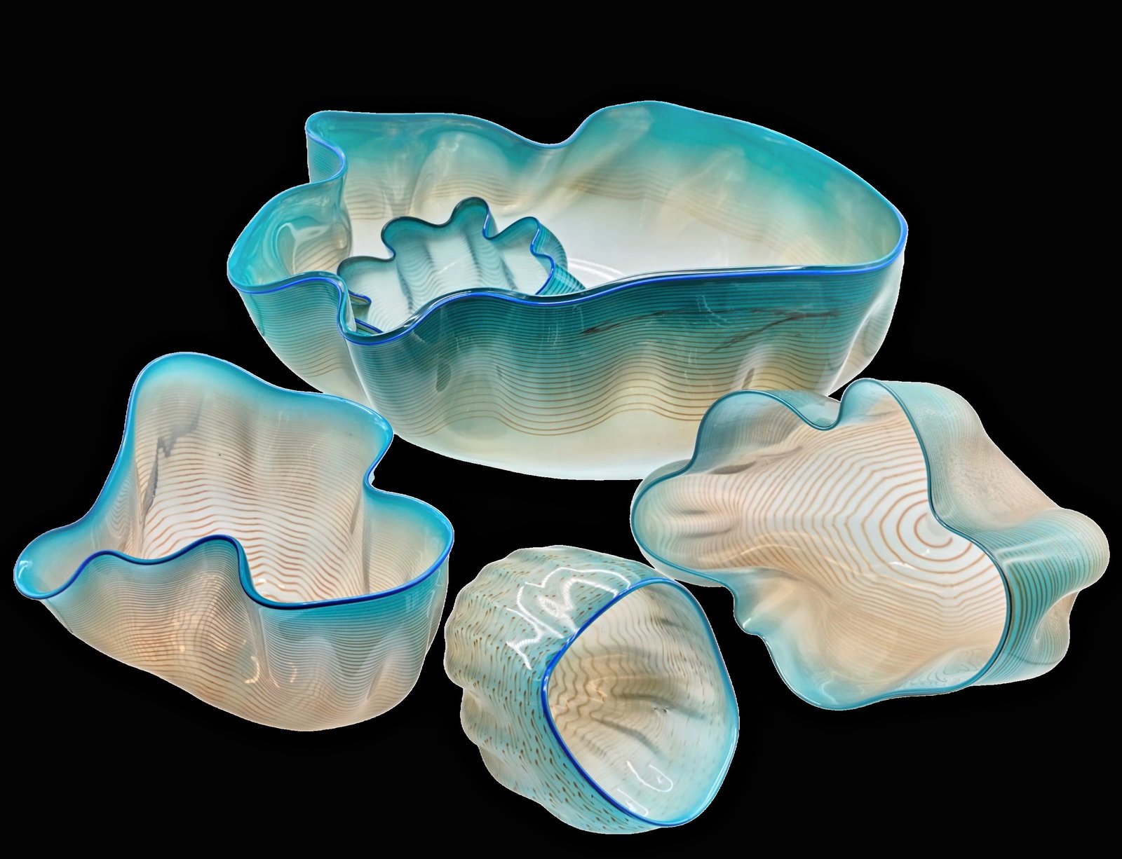 ''Seaform Set'': ''Seaform Set'' Dale Chihuly, 1982 Five-piece. Colourless, thin-walled glass, optically blown, with different coloured opal underlays in brown and turquoise tones as well as wound threads in brown, bl
