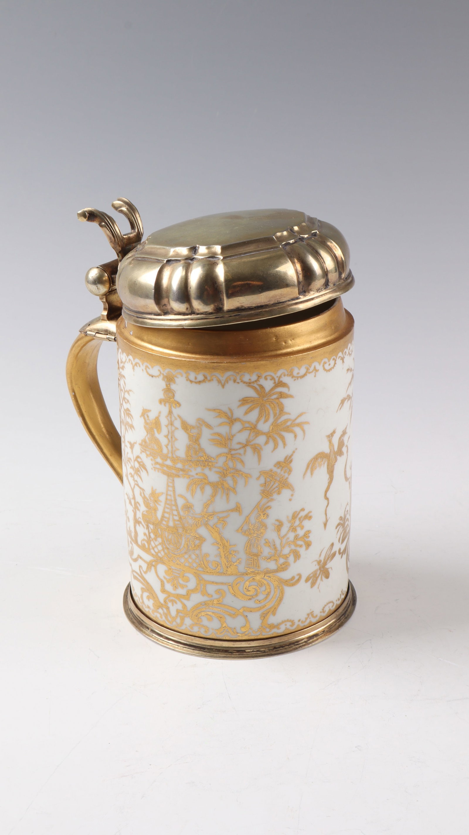 An Important House Painter's Porcelain Jug with Vermeil Mount: Important house painter's porcelain jug with Meissen vermeil mount, c. 1725, décor Bartholomäus Seuter, Augsburg, c. 1725-1730 Decoration executed on the cylindrical, glazed wall in partly etched go