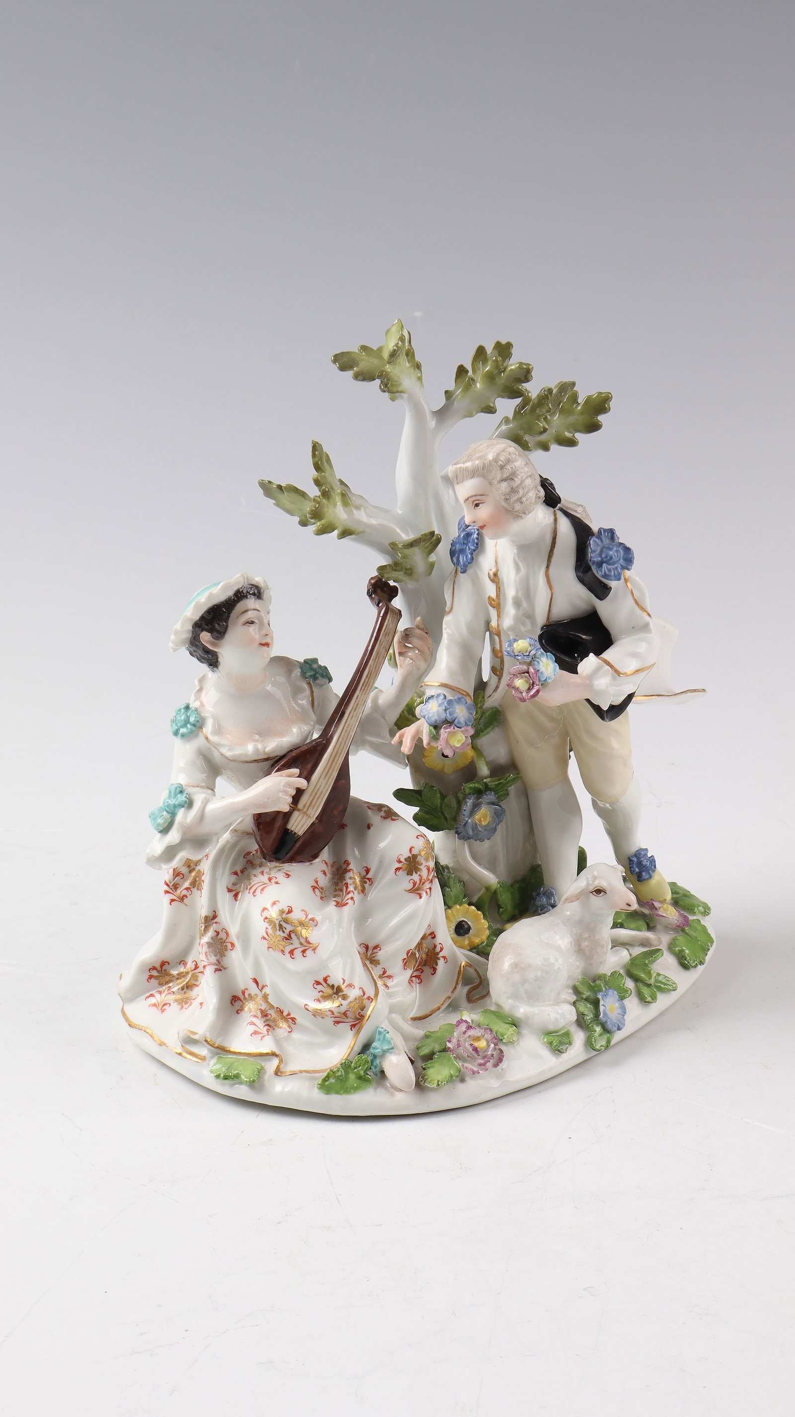Porcelain group ''Shepherdess with lute and cavalier'': Porcelain group ''Shepherdess with lute and cavalier'' Meissen around 1745, after a model by J.J.Kändler porcelain, finely polychrome painted and with gold staffage. Shepherdess sitting on a natural 