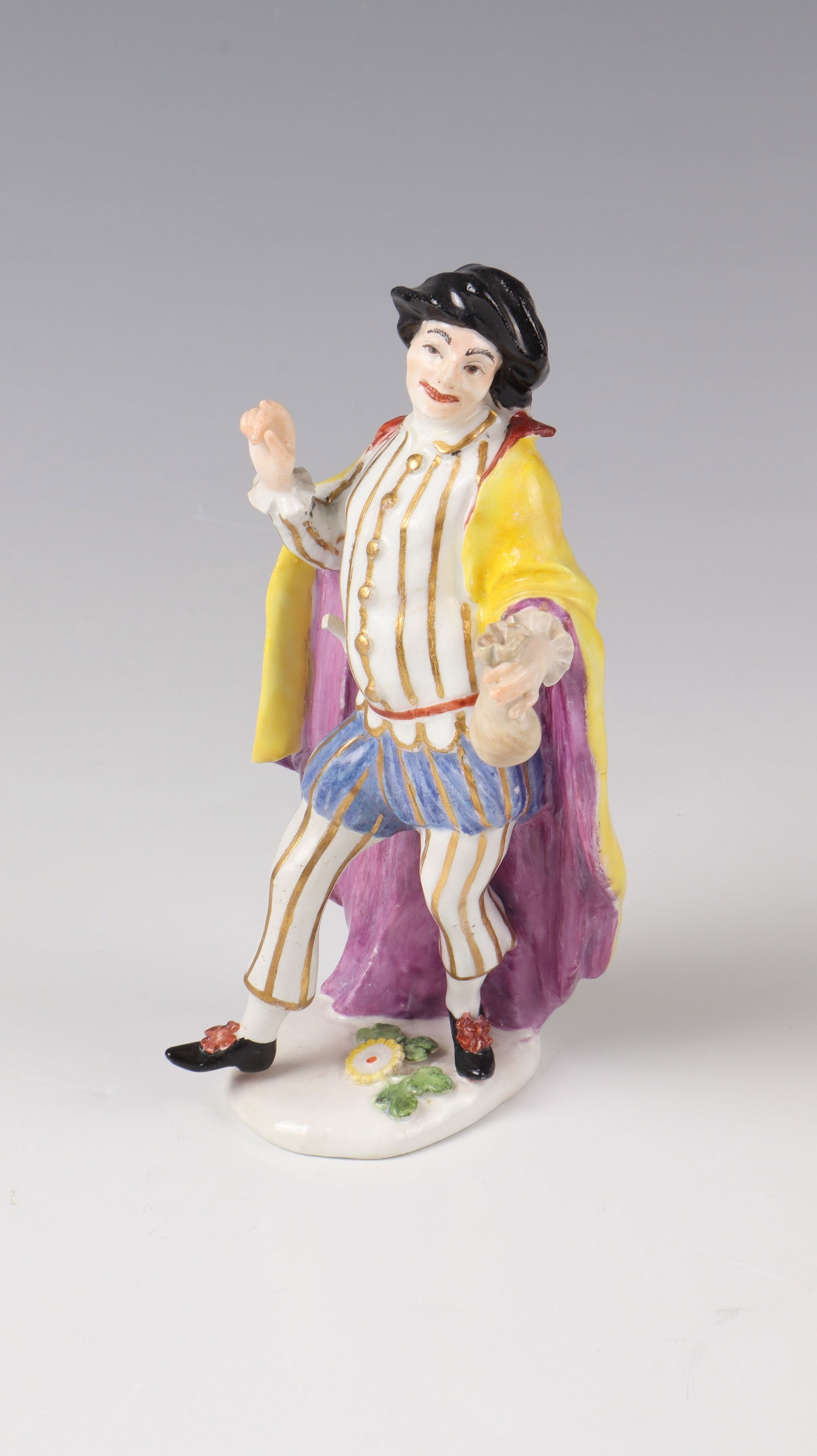 Rare figure ''Jodelet'': Rare figure ''Jodelet'' Meissen 1748, after a design by J.J.Kändler porcelain, polychrome painting and gold staffage. On a natural base. Based on the engraving, portraying the French comedian Julien