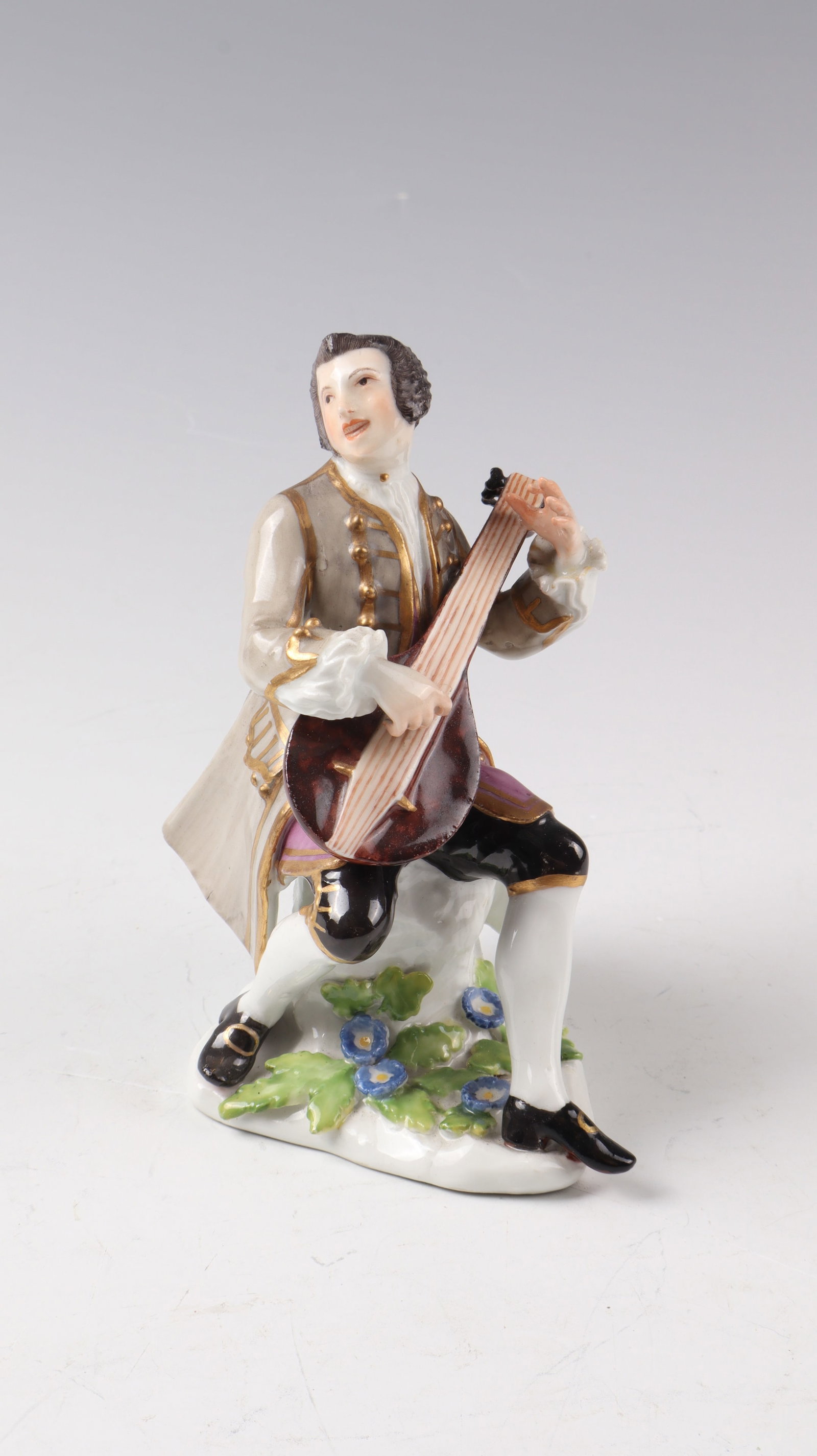 Musician with lute: Musician with lute Meissen around 1742, after a design by J.J.Kändler Musician sitting on a natural pedestal, playing the lute, in polychrome painting. Left hand restored at the base, the lute is