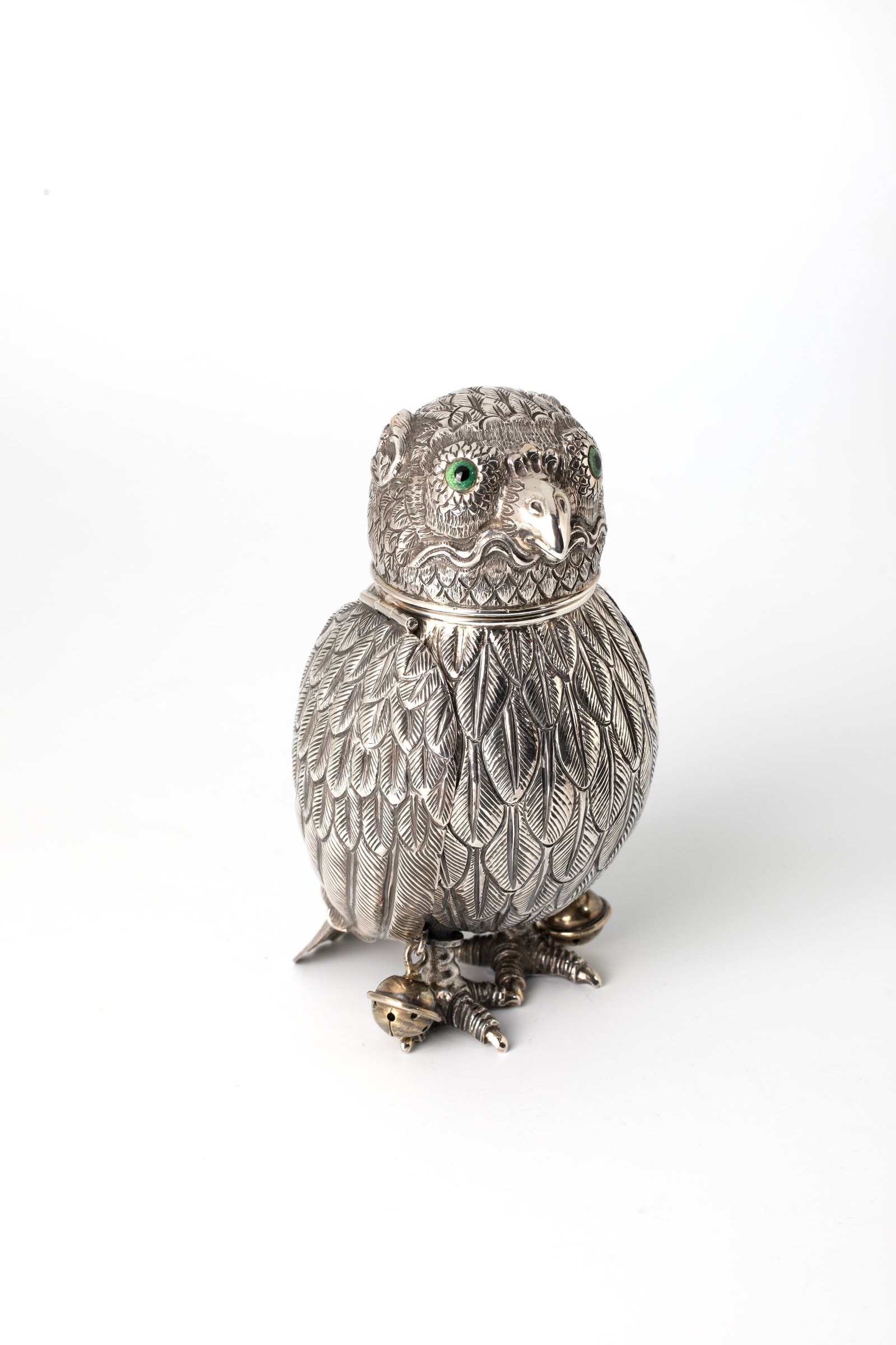 Drinking vessel in the shape of an owl: Drinking vessel in the shape of an owl German, 19th century silver, gilded, embossed, engraved and chased inside. Feathered, elongated spherical body with concave flared tail feather on two feet. Two 