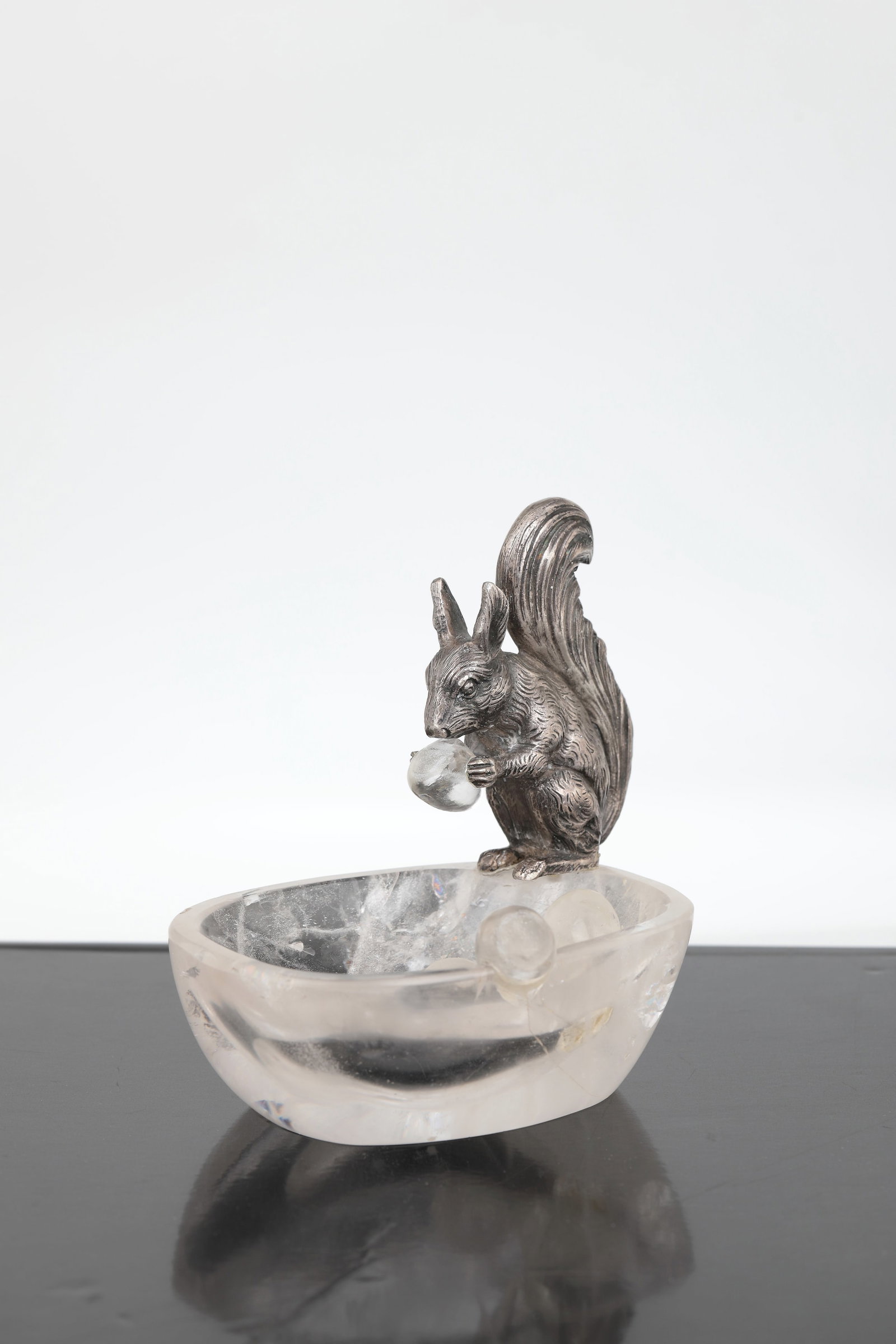 Silver squirrel on rock crystal bowl: Silver squirrel on rock crystal bowl Germany, after 1880 Fully sculpted, naturalistically worked silver squirrel, stamped ''800 crescent moon and crown''. Shell and a total of six hazelnuts made of cu